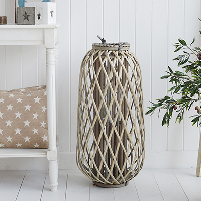 Our extra large gorgeous rustic woven lantern in white willow with chunky rope handles and glass inserts for candles.    These lanterns are ideal finishing touches for country and charming coastal displays but will complement any decor scheme in your home