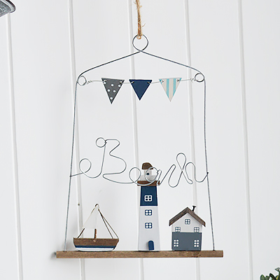 Nautical New England Coastal  Furniture and accessories for the home. A hanging beach plaque with wooden coastal scene from the White Lighthouse Furniture and Home interiors