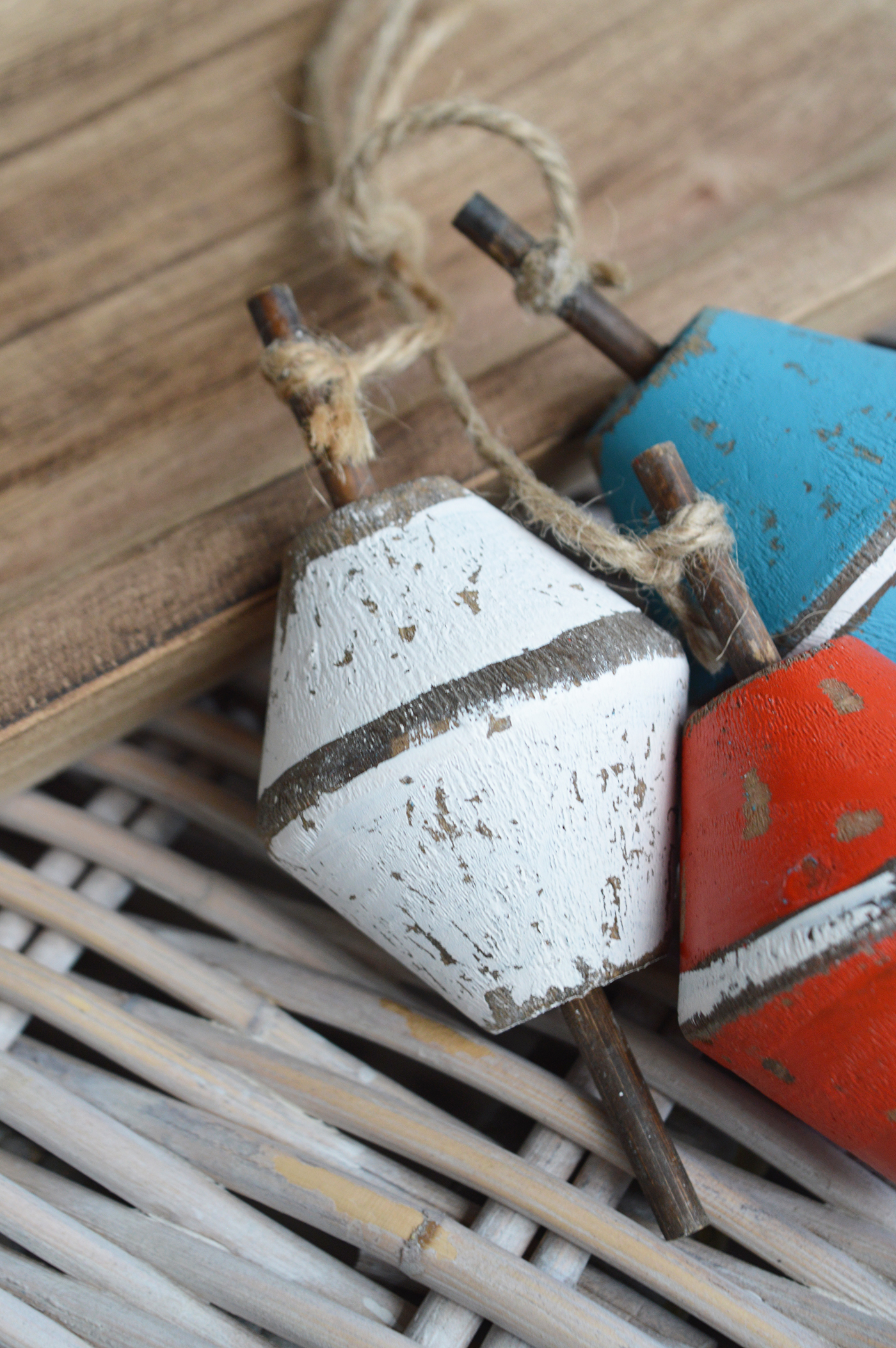 Distressed wooden float styled on a shelf for beachhouse interiors