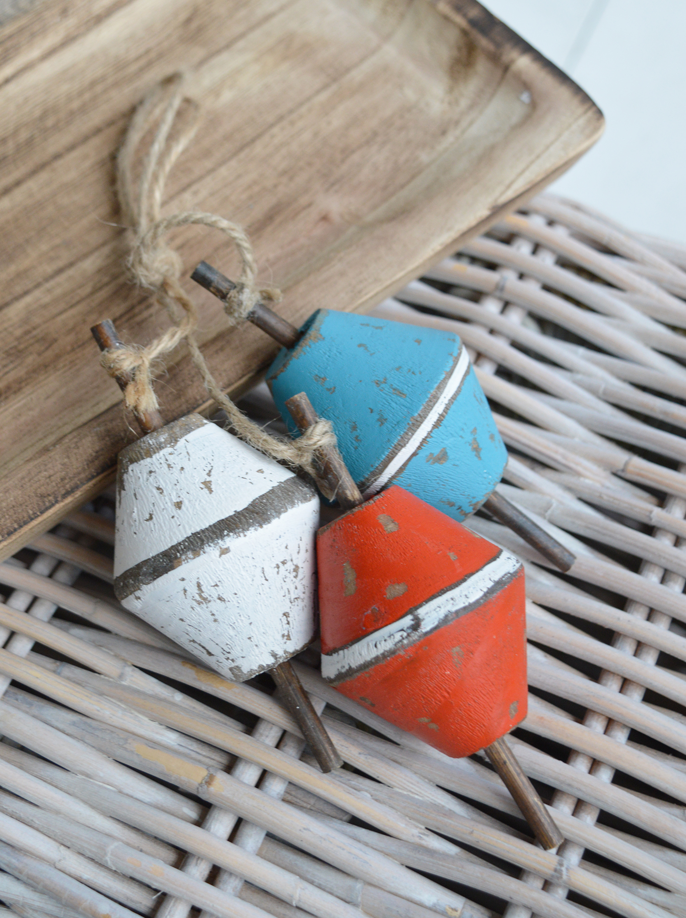 Distressed wooden float styled on a shelf for beachhouse interiors