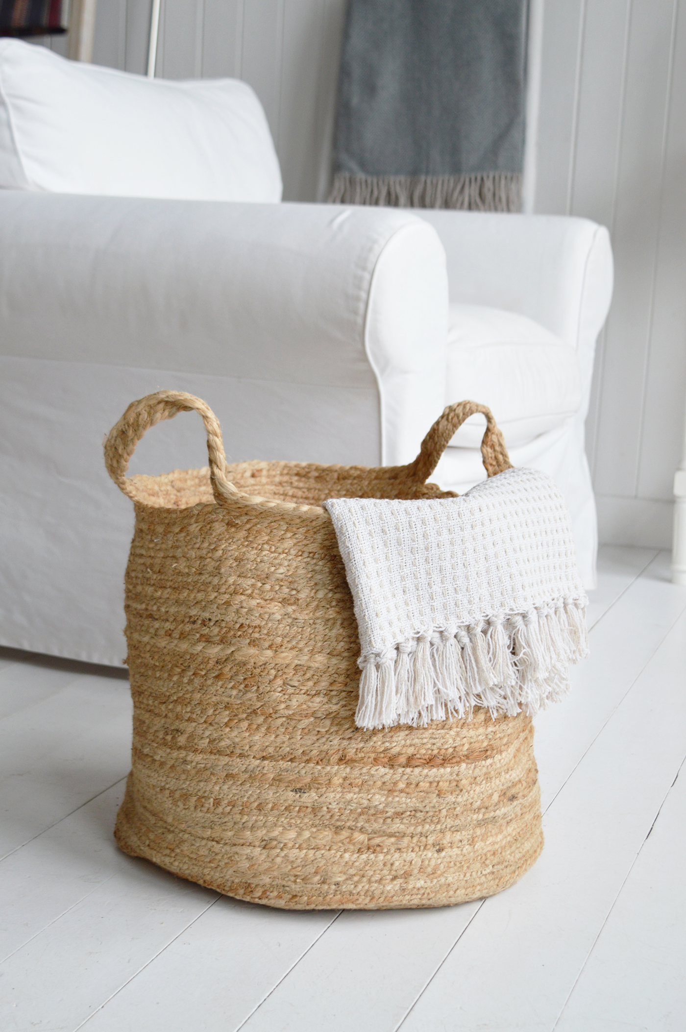 Woven textures and soft neutrals add warmth and a relaxed bohemian feel to this fresh coastal interior