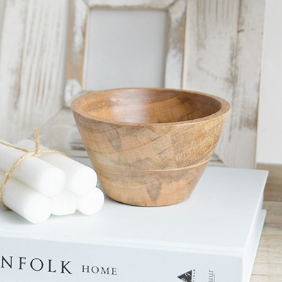 The Grafton small wooden bowl adds a natural touch to any New England coastal or farmhouse space, perfect for serving snacks or displaying decorative items