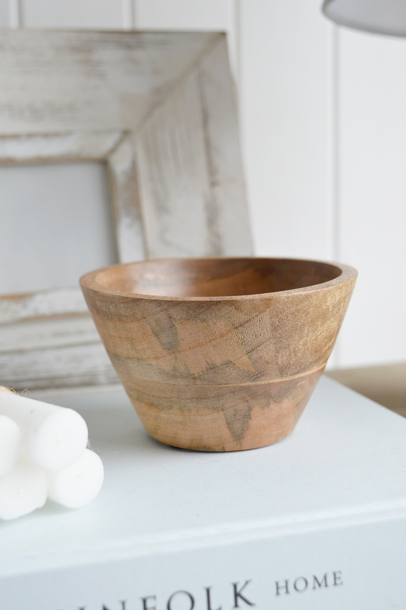 The Grafton small wooden bowl adds a natural touch to any New England coastal or farmhouse space, perfect for serving snacks or displaying decorative items