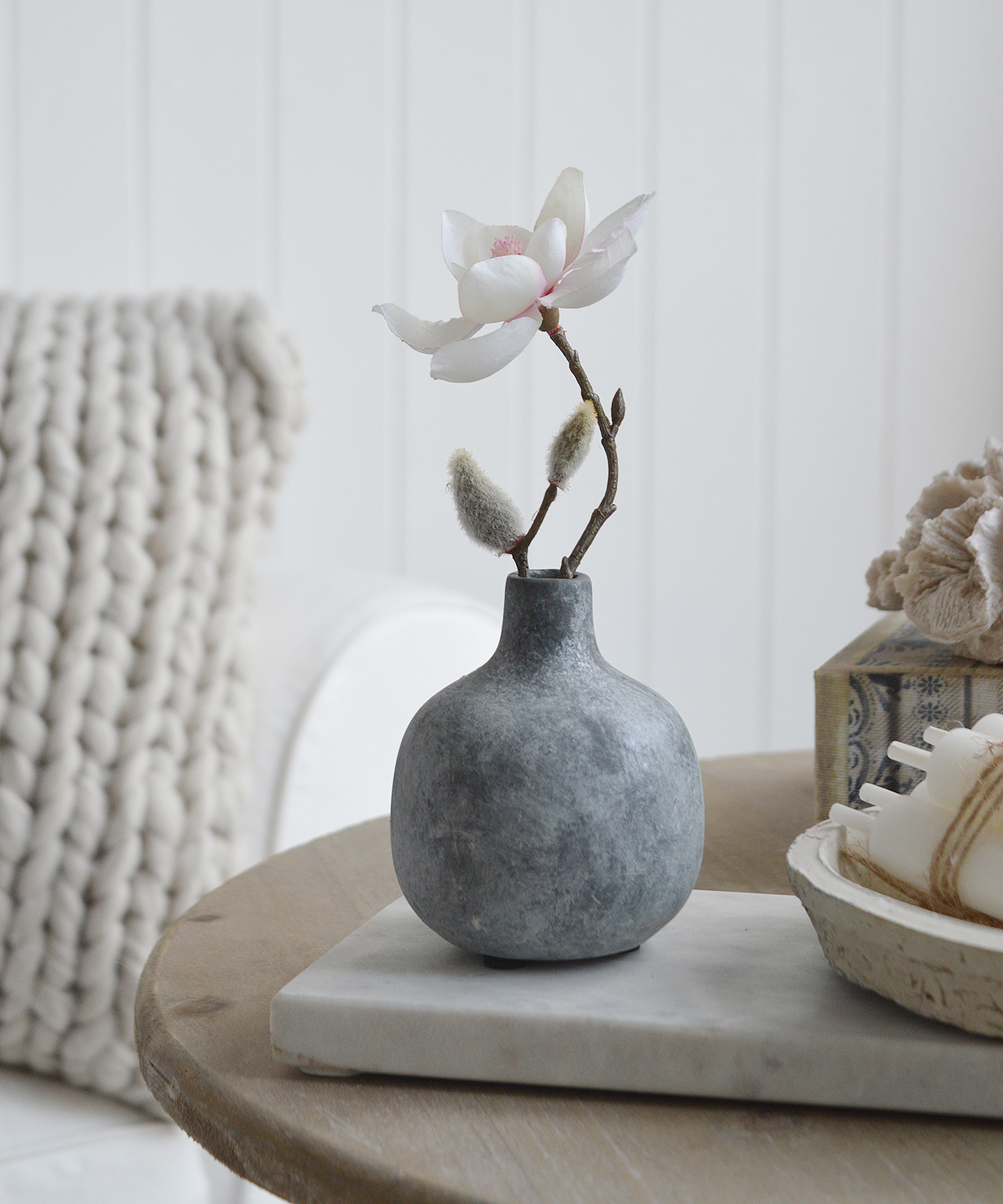 Slate grey coloured small Bradley pot with a stem of Magnolia