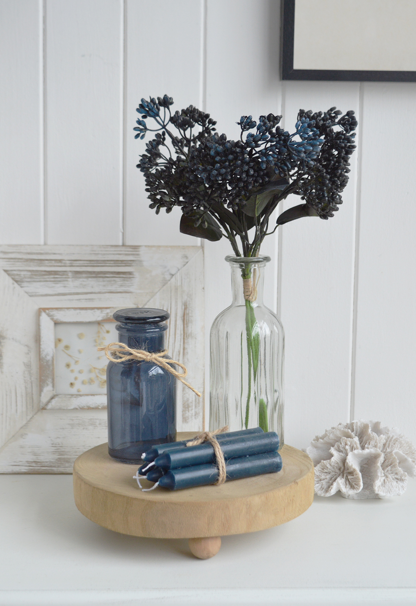 Tied with rustic twine, this bundle of blue candles beautifully complements neutral interiors and coastal home accessories.