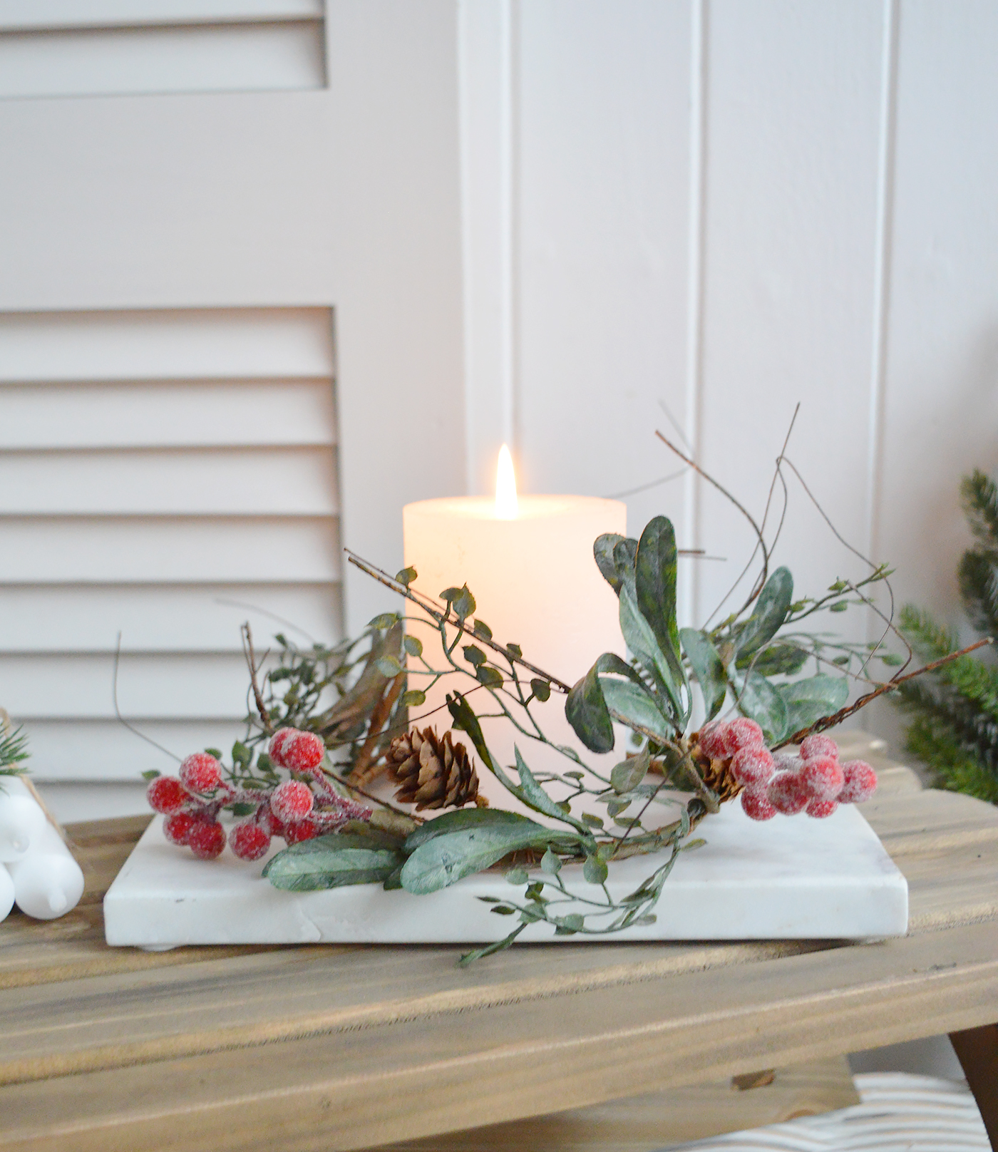 Create a beautiful centerpiece with this gorgeous winter candle ring with gently frosted leaves, little pinecones and contrasting red berries - Luxury Christmas table decoration from The White Lighhtouse New England Stlye homes and interiors