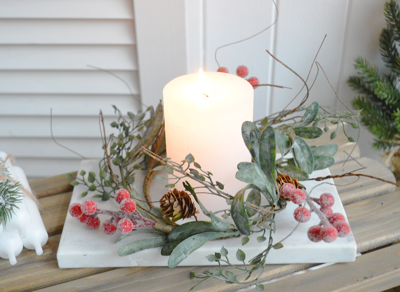 Create a beautiful centerpiece with this gorgeous winter candle ring with gently frosted leaves, little pinecones and contrasting red berries - Luxury Christmas table decoration from The White Lighhtouse New England Stlye homes and interiors