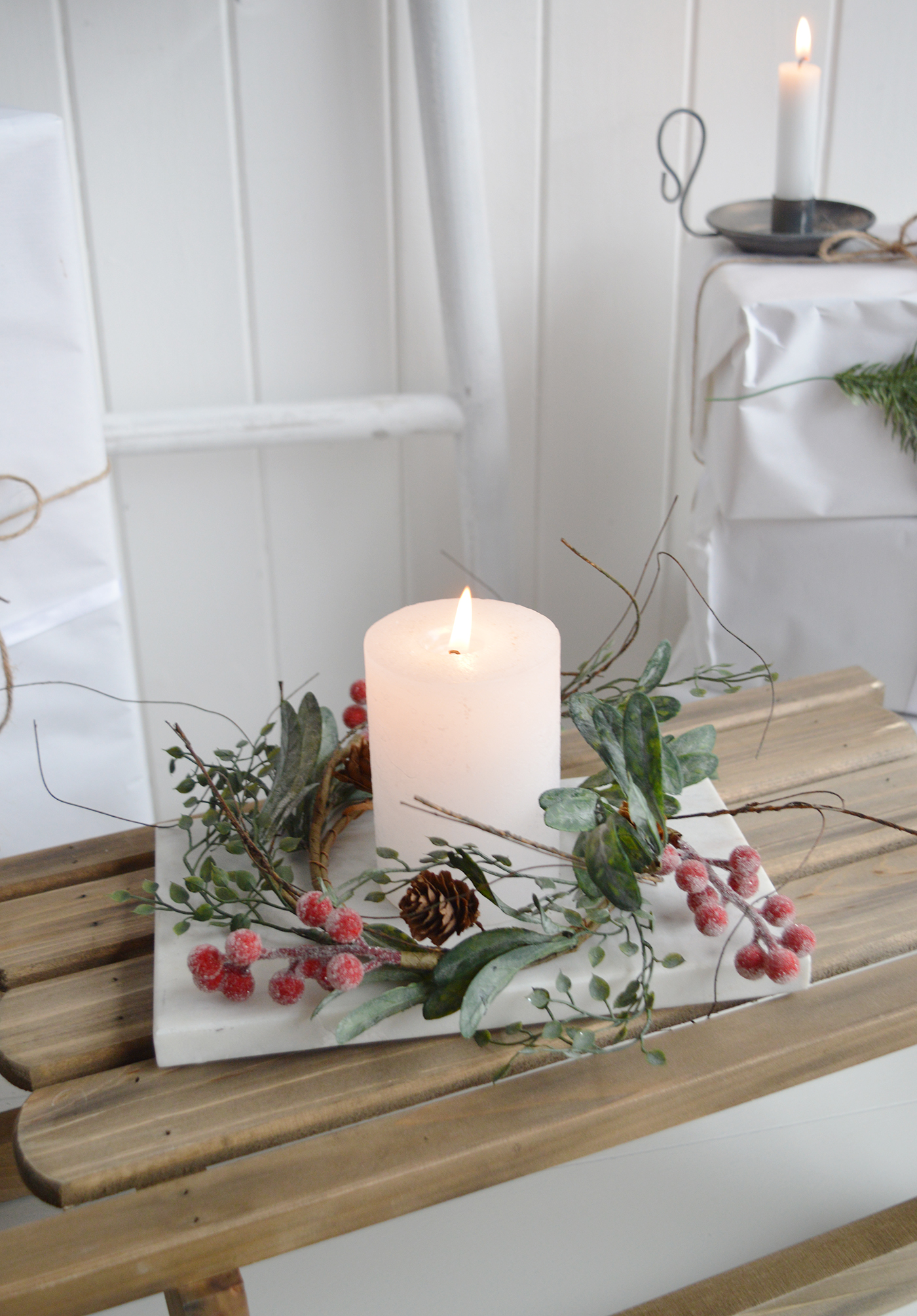 Candle ring with red barries for winter decorations