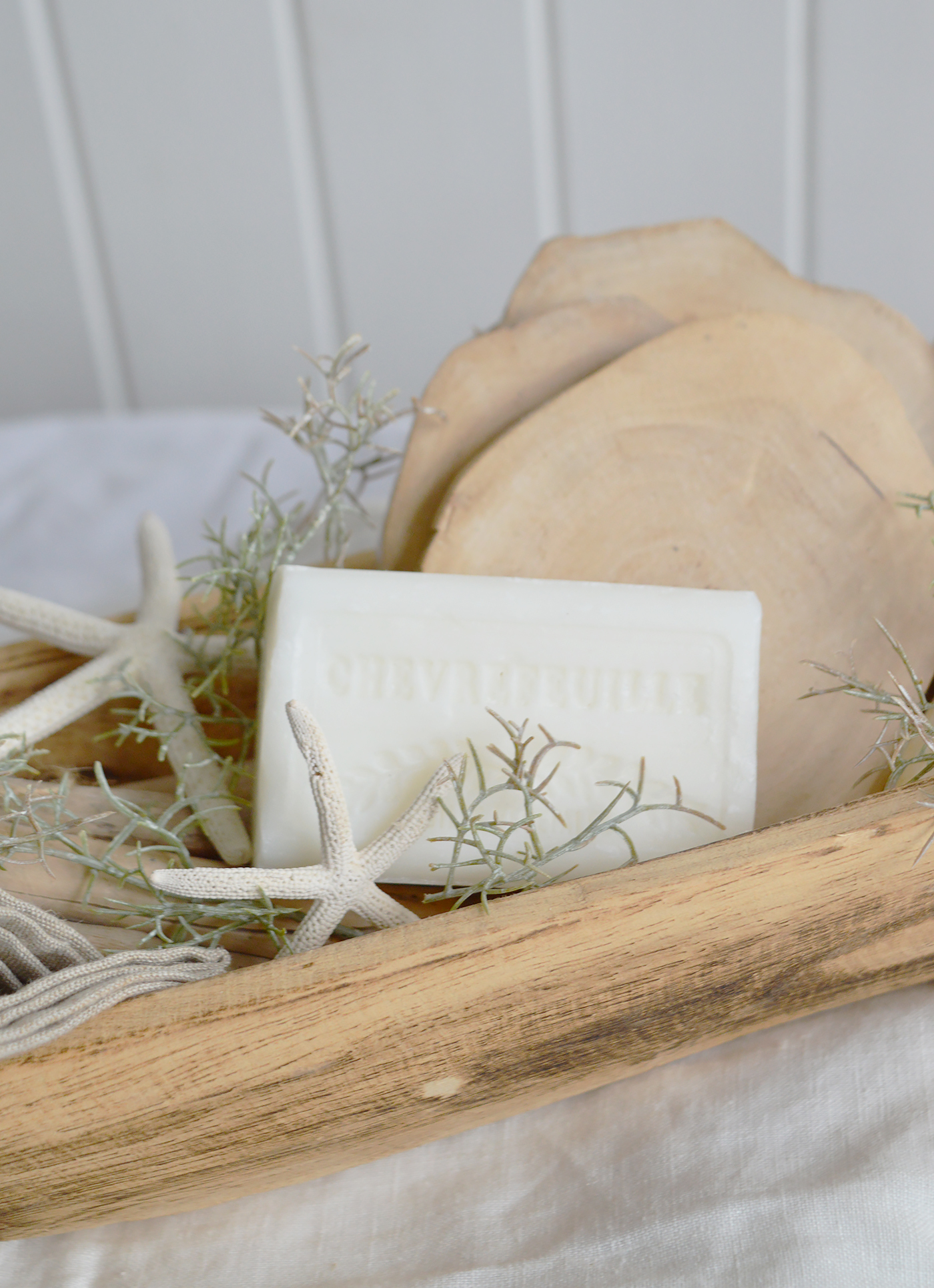 Designed with a natural, elongated silhouette, this versatile wooden bowl can be filled with decorative accents or left empty as a striking statement piece, offering endless styling possibilities from season to season.