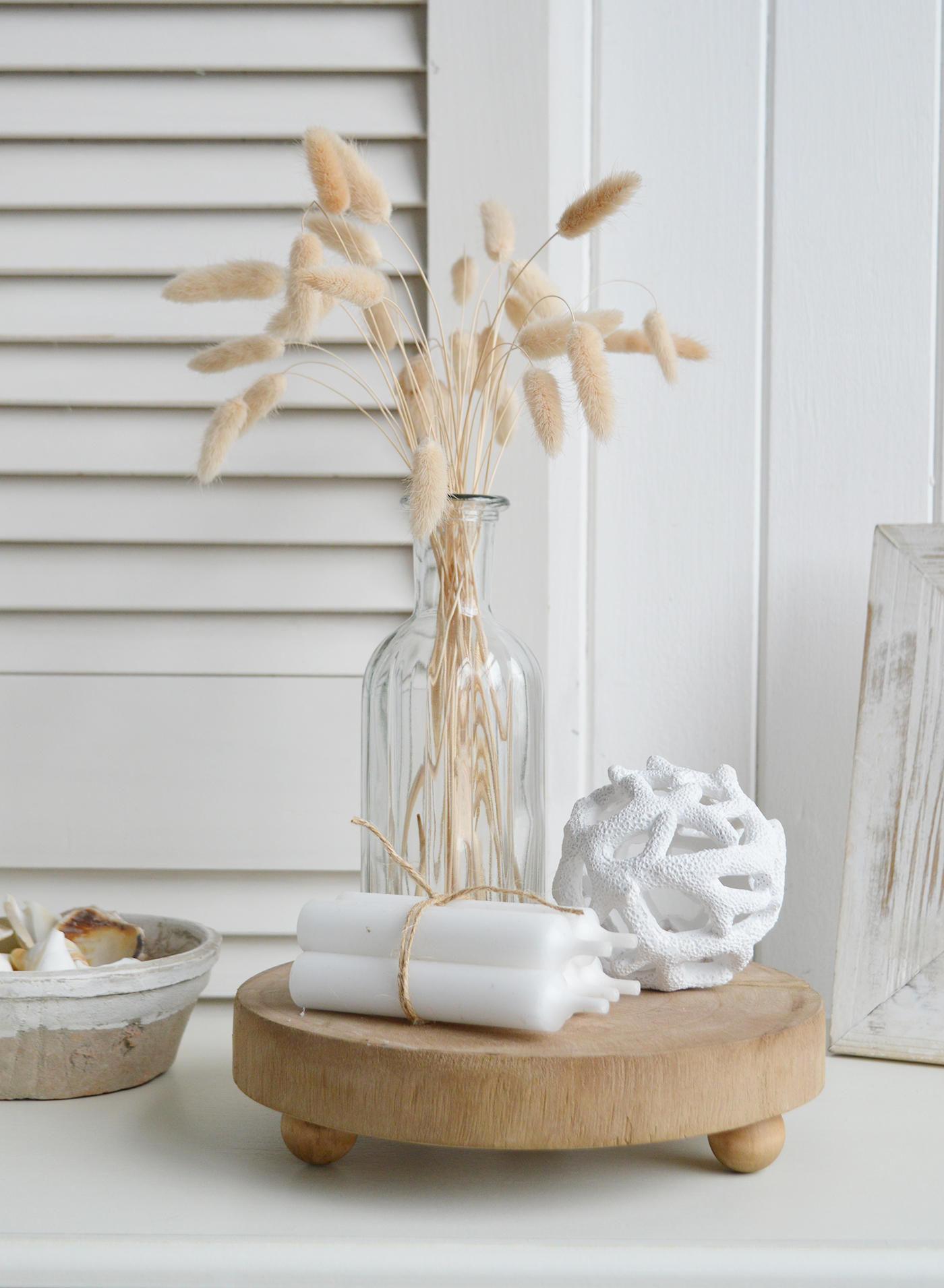 a neutral coastal styling on the Chadwick wooden tray with the resing faux coral ball