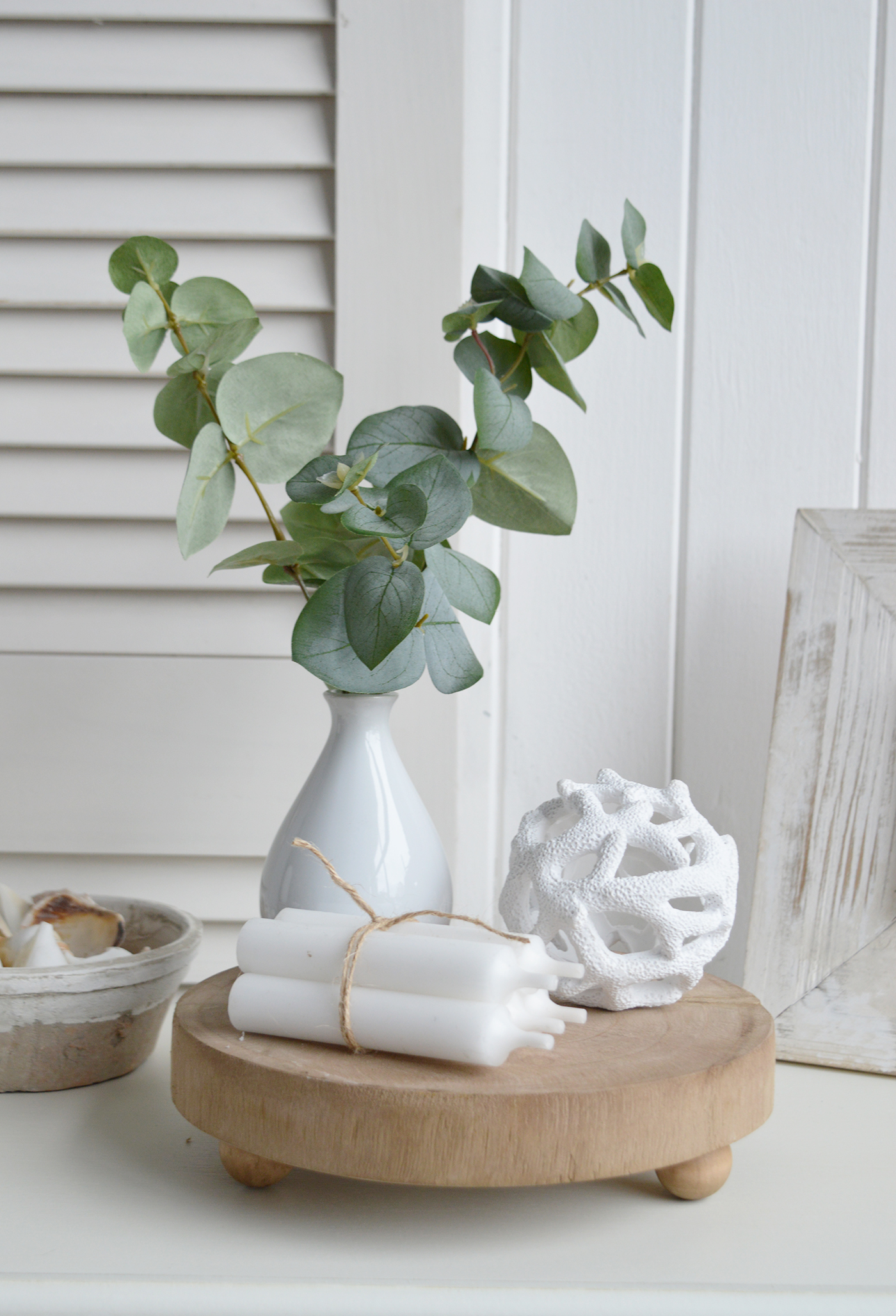 The small resing white coral ball on the Chadwick tray with Eucalyptus