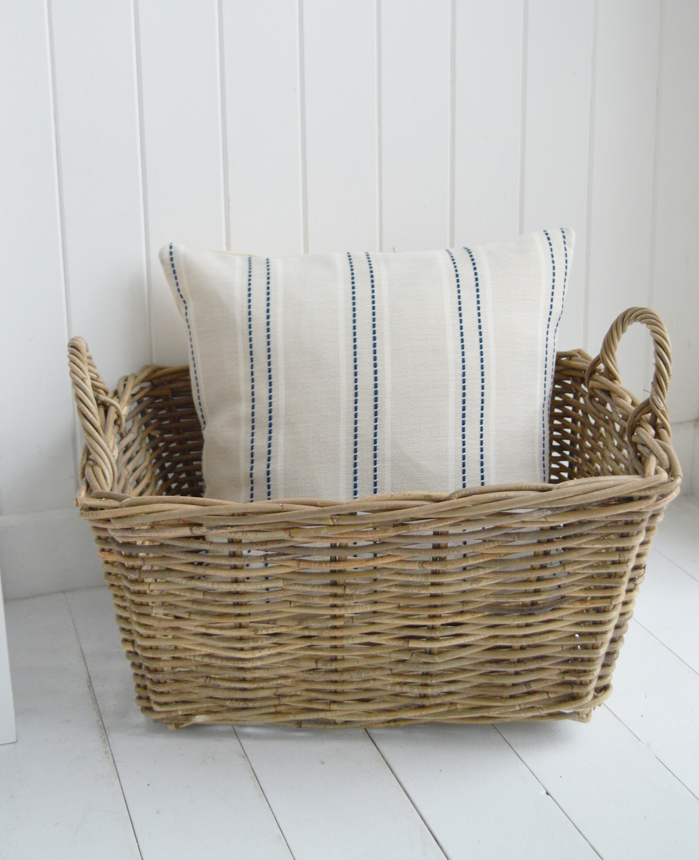 The navy stripe detailing adds definition without overpowering light, airy spaces