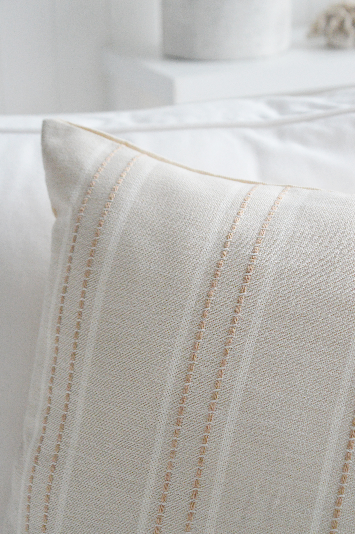 With its gentle neutral stripe, this cushion cover adds subtle depth to New England inspired interiors without overpowering a calm, refined space.