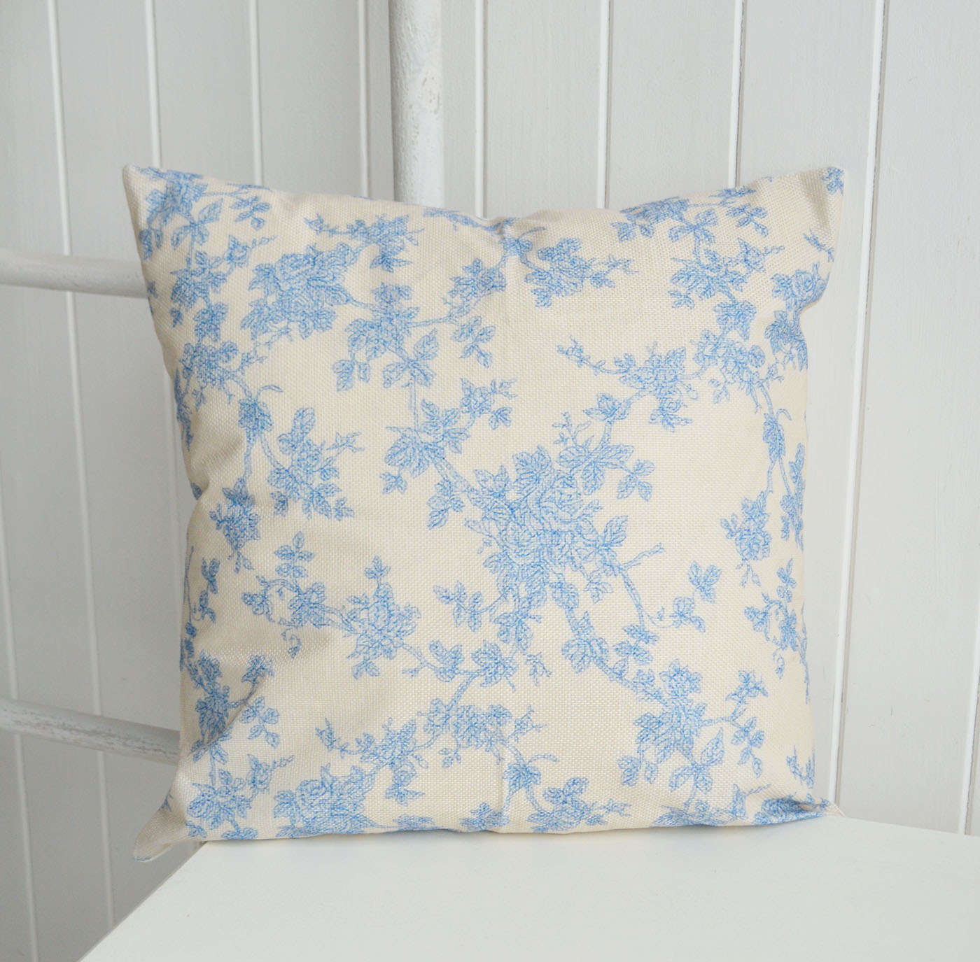 Soft blue florals and warm neutral tones give the Haverhill cushion cover a timeless New England feel, perfect for relaxed elegant interiors.