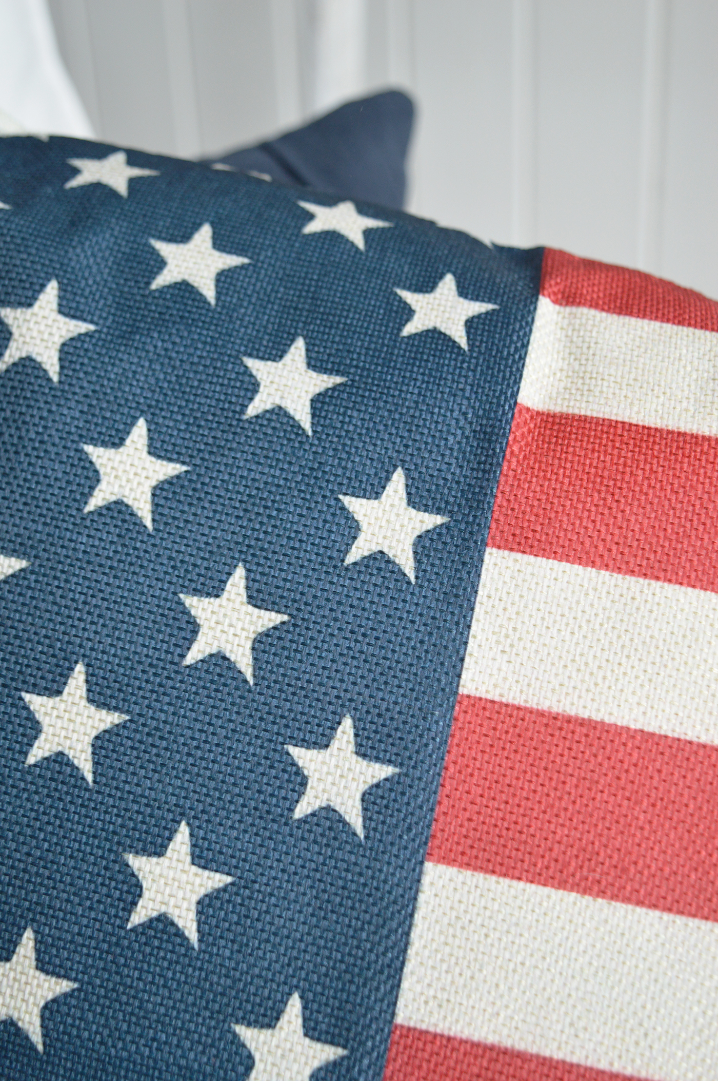 The woven stars and stripes design adds classic Americana charm to coastal cottage interiors