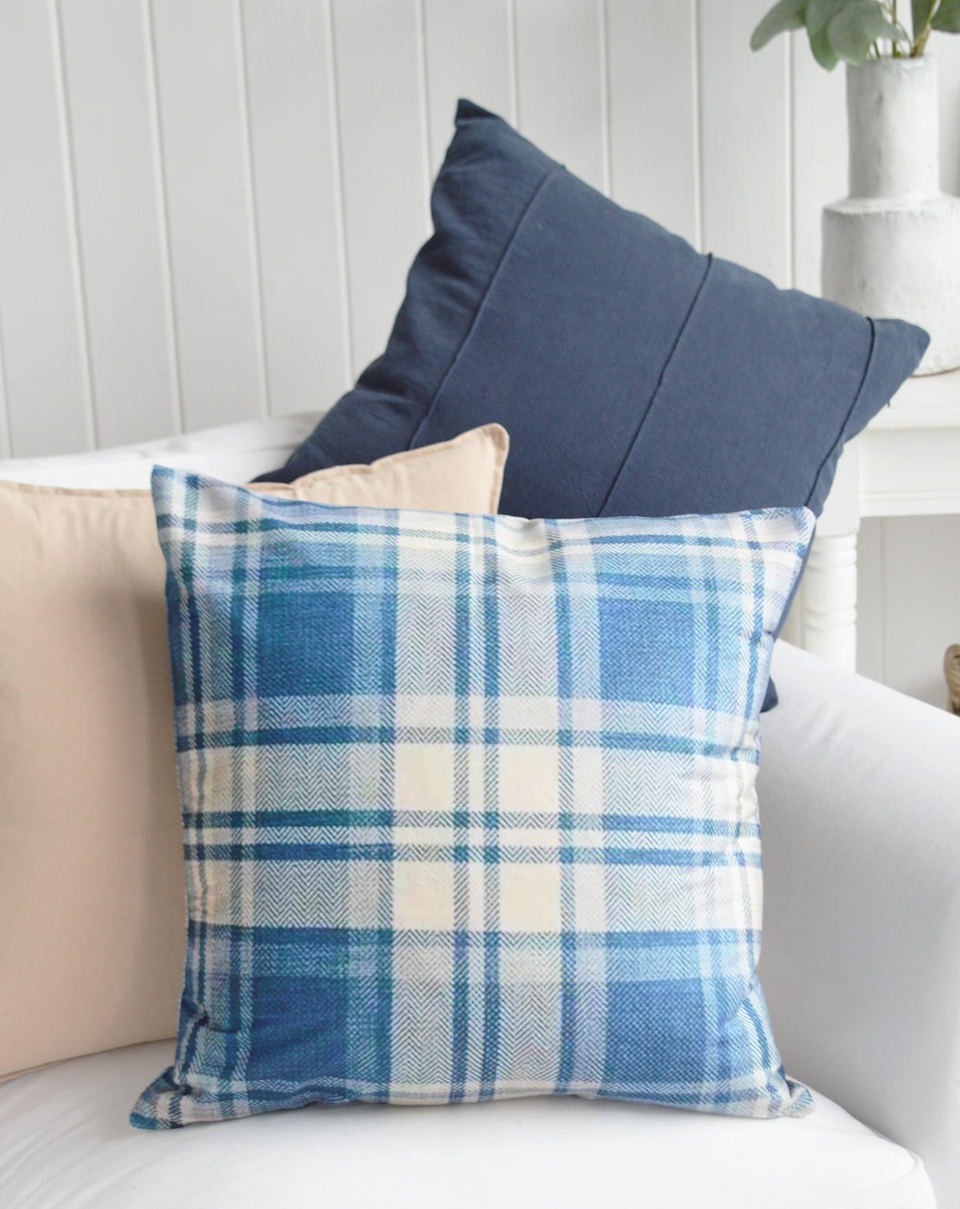 Create a relaxed Hamptons-inspired interior with the fresh blue and ivory tones of the Ashford Cushion Cover. Perfect for coastal living spaces, this checked cushion adds warmth, texture and character to sofas and armchairs.