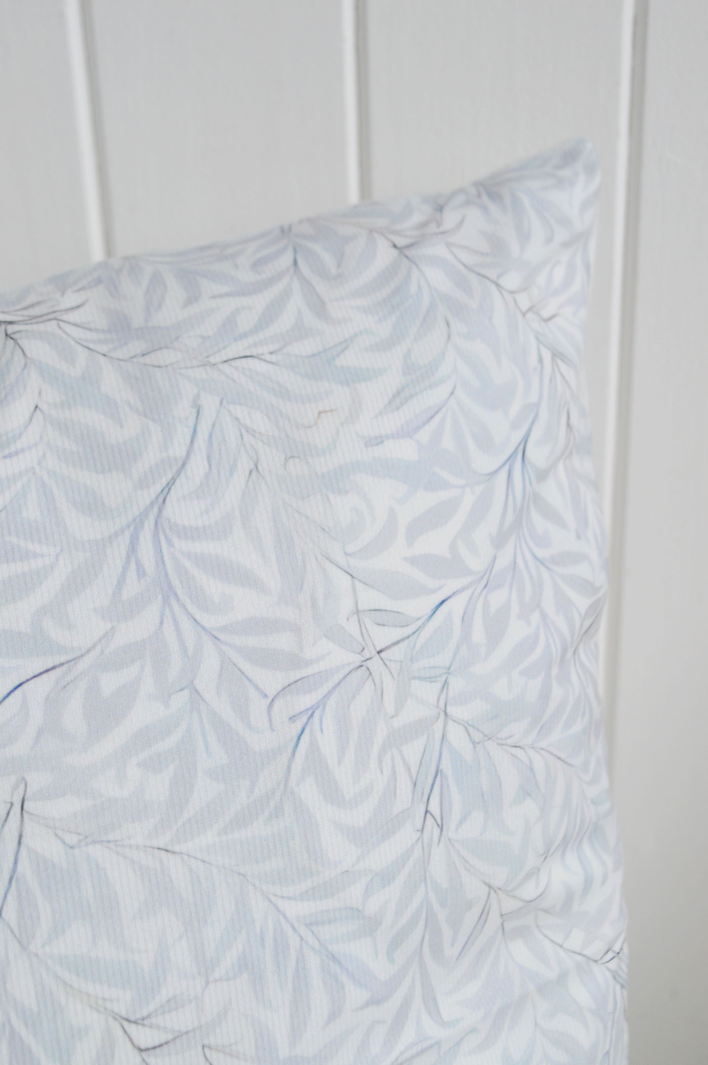 With its soft pale blue leaf pattern and delicate layered detailing, the Dalton Cushion Cover is perfect for coastal interiors, Hamptons interiors and elegant New England interiors, bringing a calm luxurious feel to sofas, beds and timeless coastal furniture styling.
