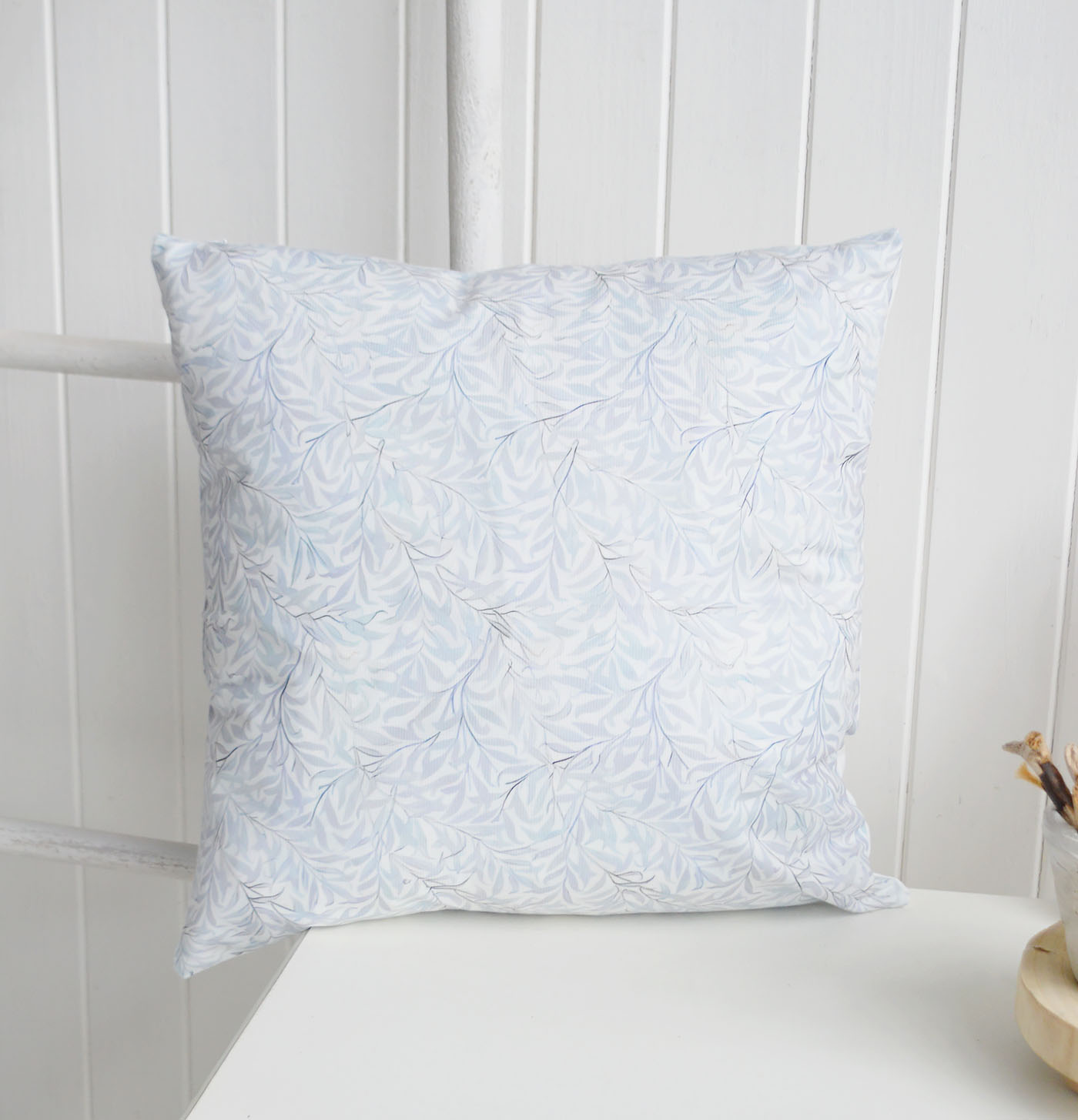 The Dalton Cushion Cover brings a soft layered elegance to coastal interiors and Hamptons interiors with its delicate pale blue botanical design, creating a calm New England interiors look that pairs beautifully with luxury cushions, neutral textures and timeless coastal furniture.