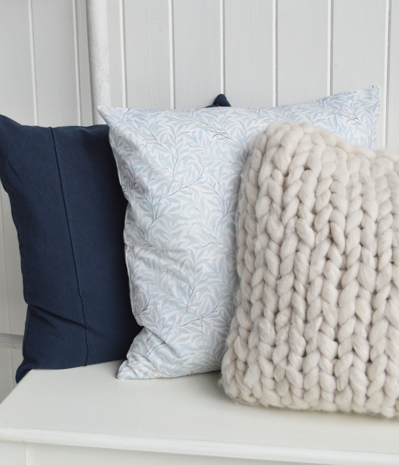 The Navy Marlow Cushion Cover adds depth and timeless elegance to coastal interiors, pairing beautifully with the soft blue prints of the Dalton cover and chunky neutral knits to create relaxed Hamptons interiors and luxurious New England interiors with a calm coastal feel.