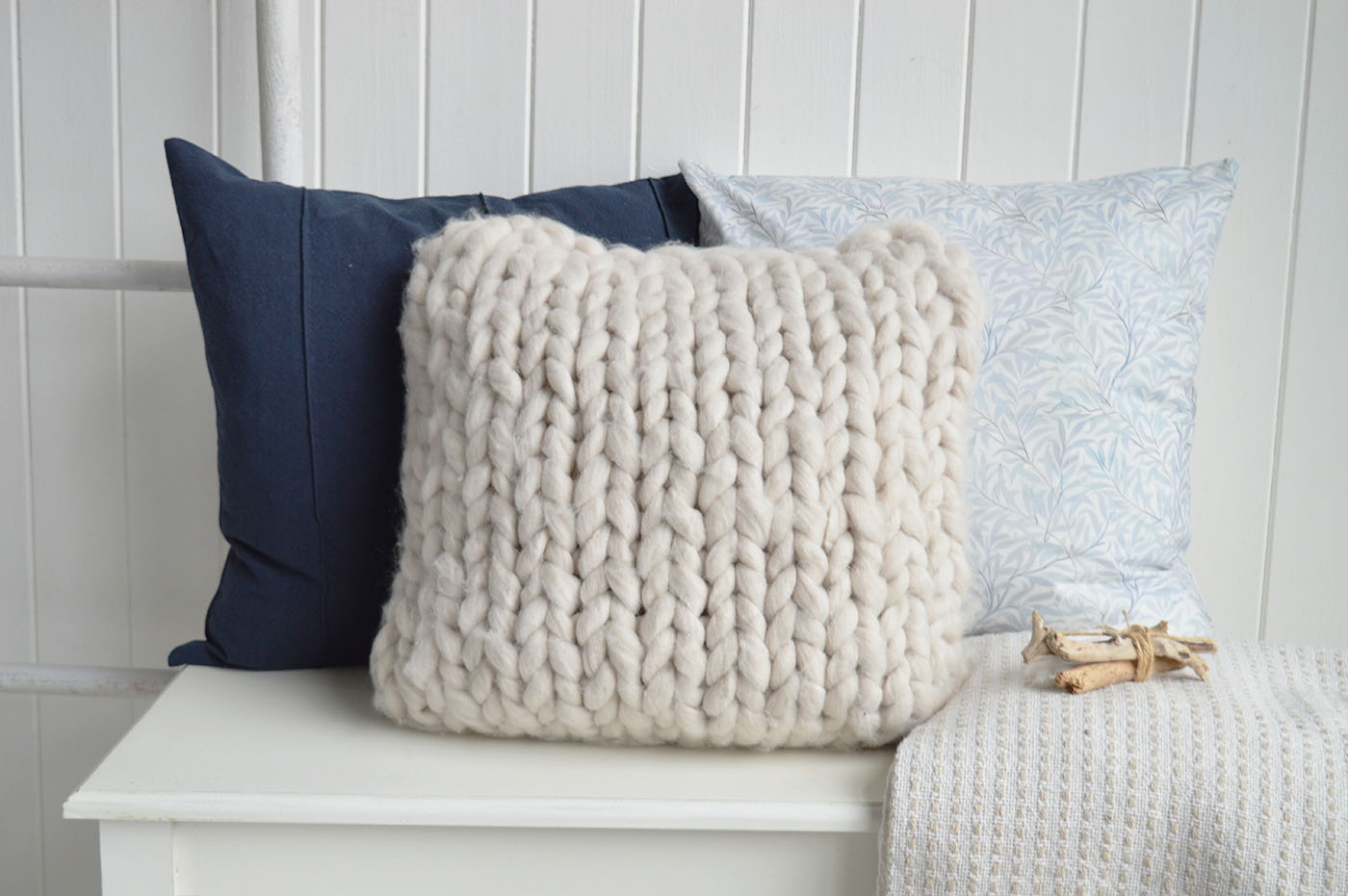 Create a calm layered look with the Navy Marlow Cushion Cover, Mayfair knitted cover and Dalton soft blues cover, combining rich navy tones, soft knitted textures and delicate blue prints for timeless coastal interiors, luxury cushions and elegant Hamptons interiors inspired by relaxed New England living.