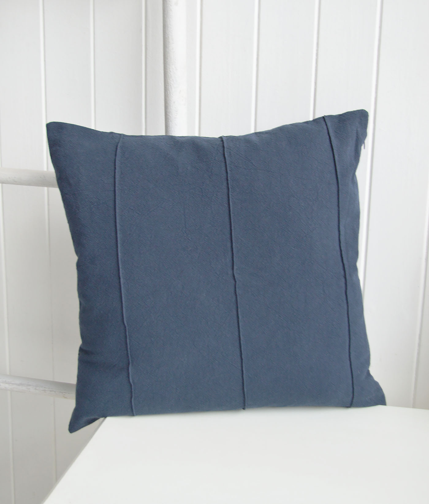 The Navy Marlow Cushion Cover is a timeless addition to coastal interiors and Hamptons interiors, bringing a refined New England style to sofas, armchairs and beds with its soft textured fabric, classic panel detailing and rich navy tone, perfect for layering with luxury cushions, coastal furniture and elegant New England interiors.