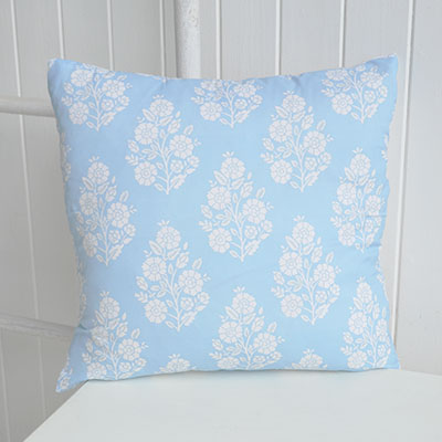 Soft blue tones and delicate white florals bring a fresh New England feel to this timeless cushion cover.