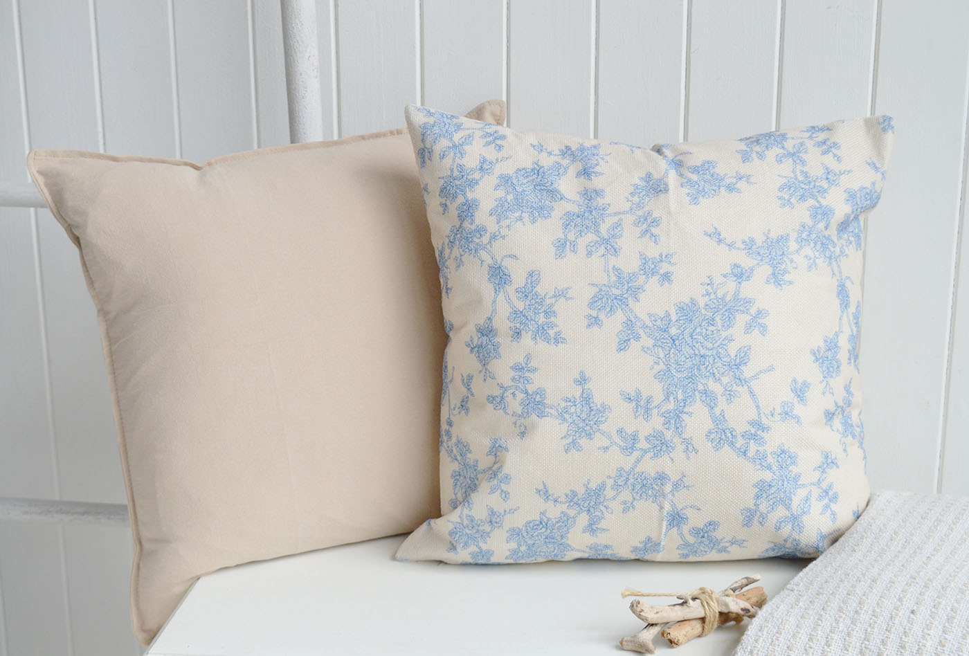 Soft blue florals and warm neutral linens create a timeless Hamptons look, perfect for elegant coastal interiors and relaxed New England style homes.