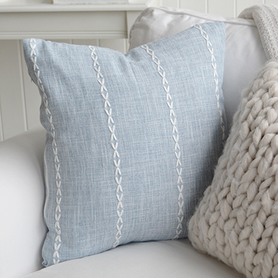 The Friendship Cushion captures the simplicity of New England coastal style with its soft blue hue and subtle stitched detail.