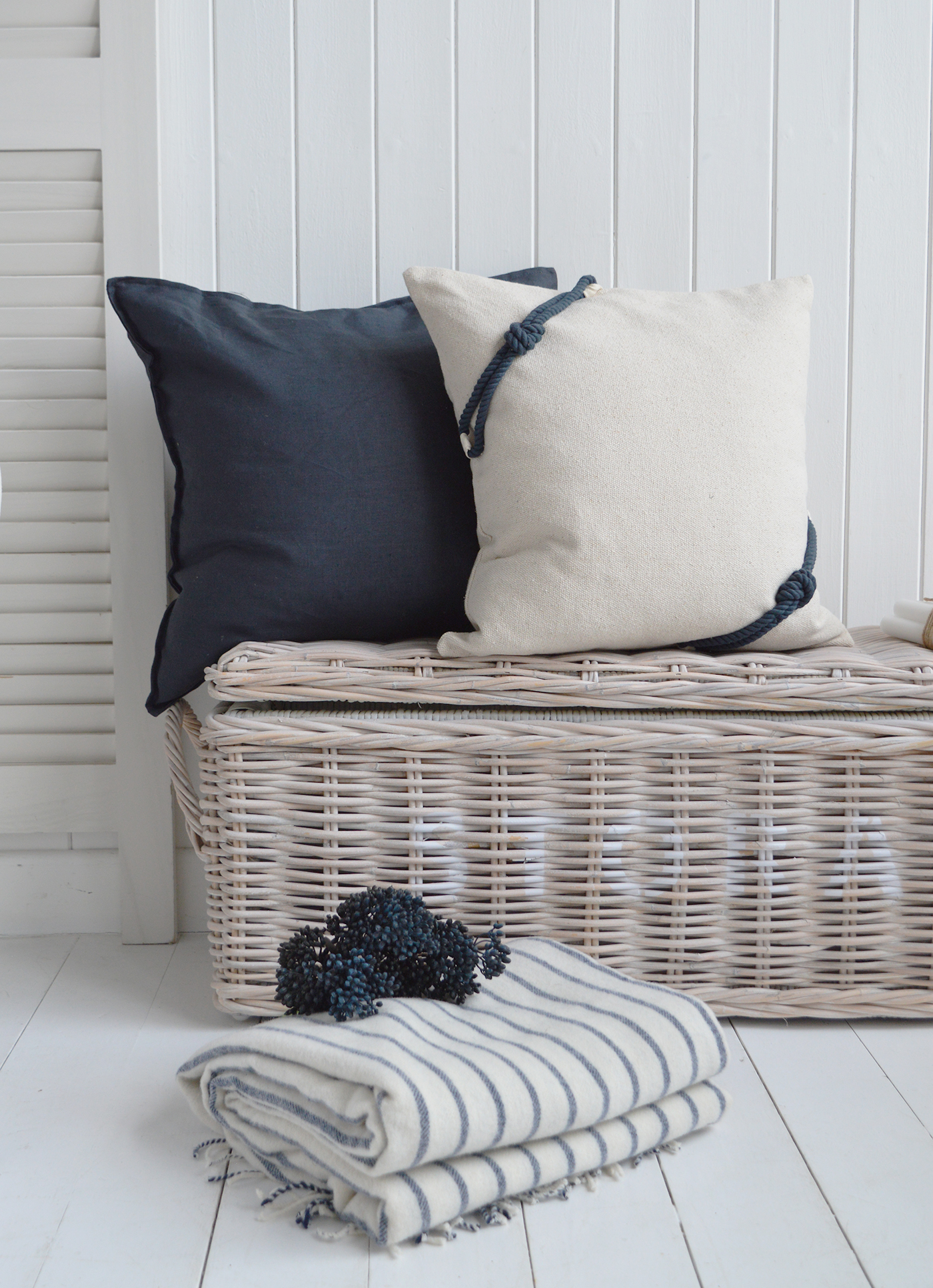 Navy blue cushion with a textured rope design, adding a coastal and nautical touch to home décor