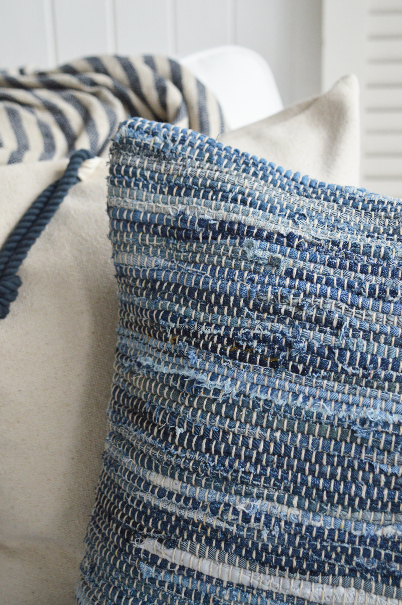 Decorative cushion with a beachy texture, styled for coastal interiors