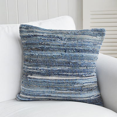 The Seascape handwoven cushion inspired by ocean hues, ideal for beach-style interior settings. Decorative cushion with a beachy texture, styled for coastal interiors