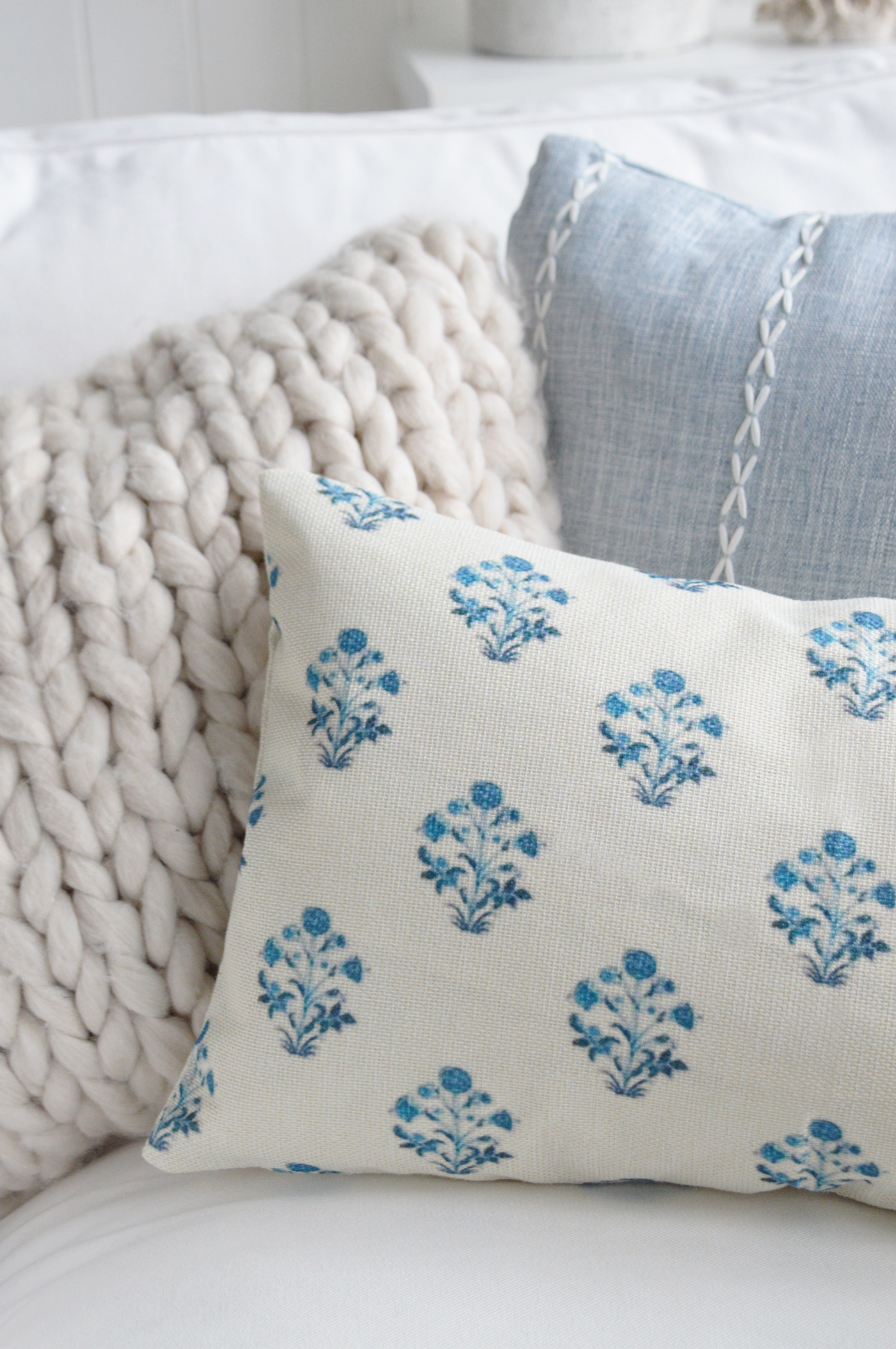 The soft blue floral print brings understated charm to beach house interiors and cottage living rooms.