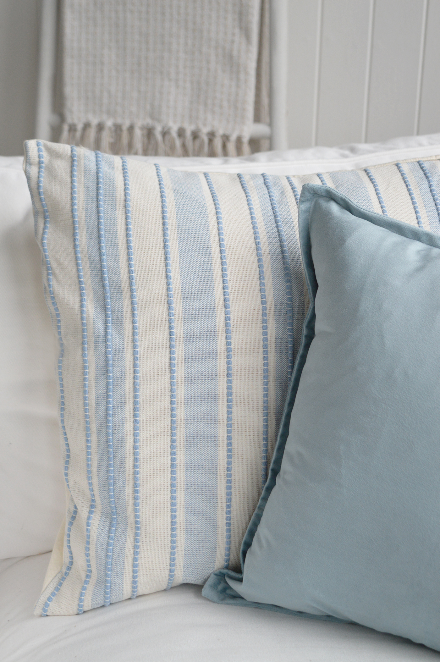 Its muted blue shade complements navy cushions, striped fabrics and neutral coastal décor.