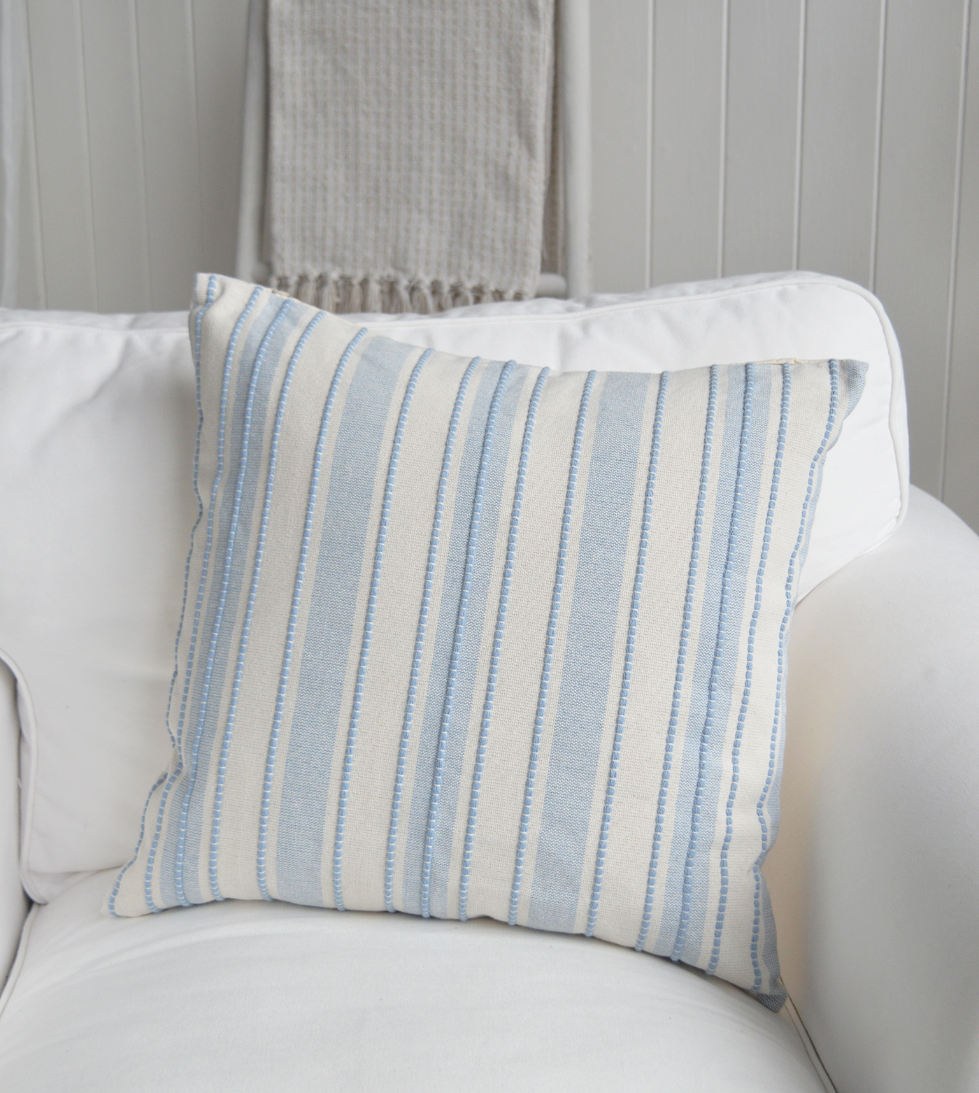 The Bristol Cushion Cover features timeless pale blue and ivory stripes for a fresh coastal look.