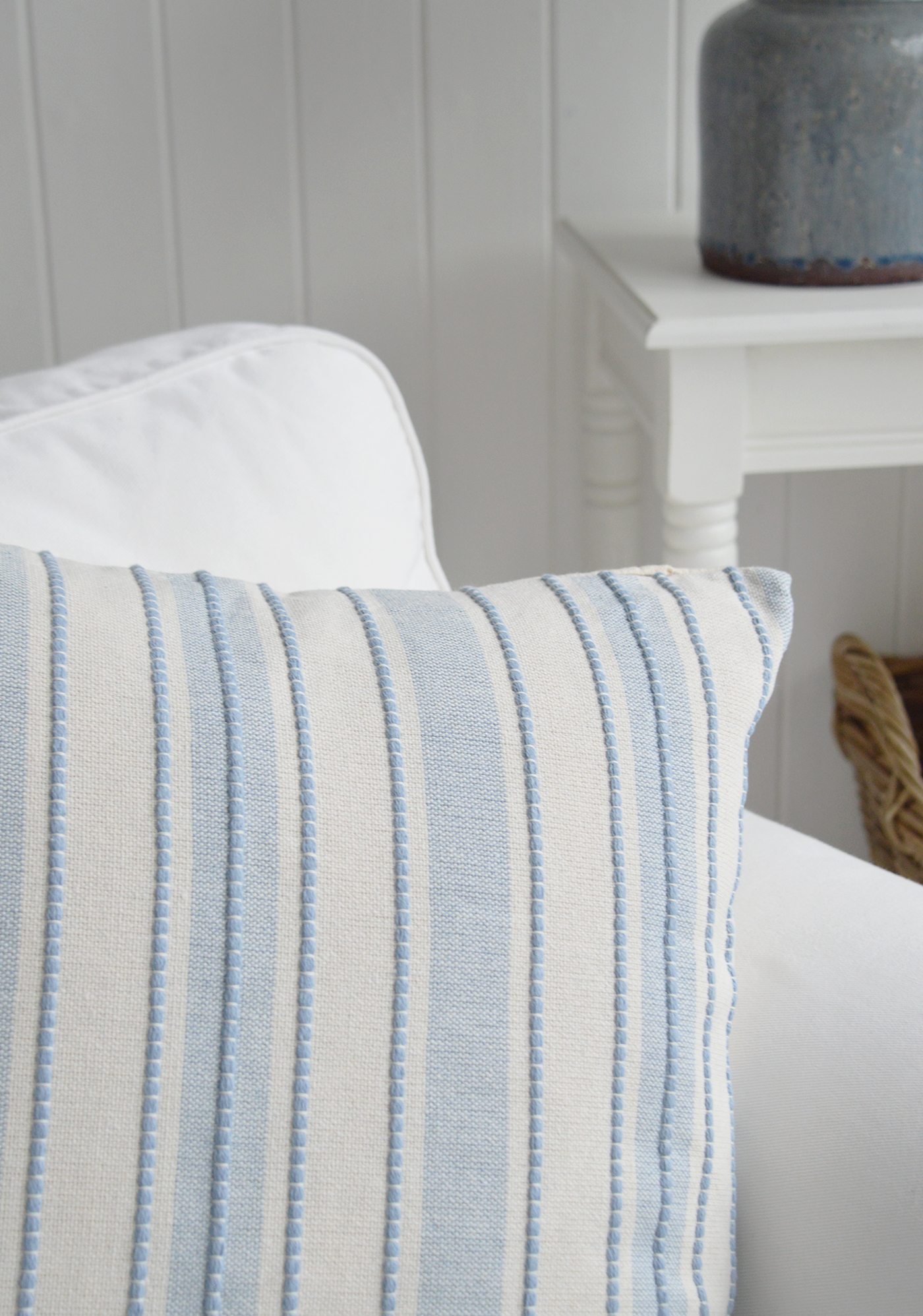 Textured woven detailing adds depth and character to this classic blue striped cushion cover.