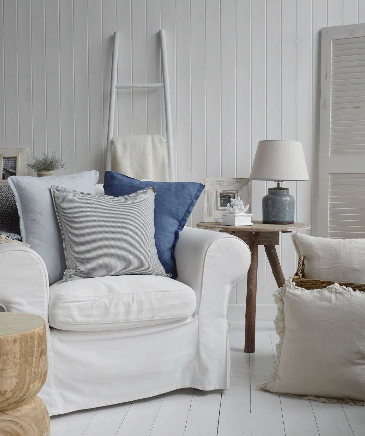 A coastal living room decorated in beach house colours with the Hamilton linen cushion covers