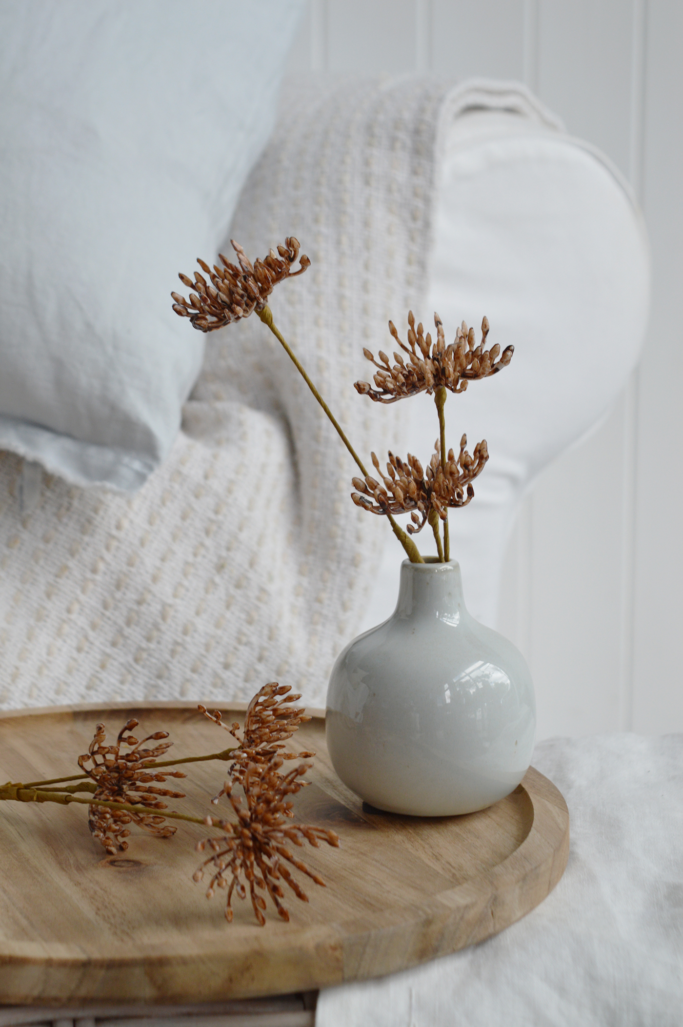 Faux floral arrangement for New England farmhouse coffee table styling