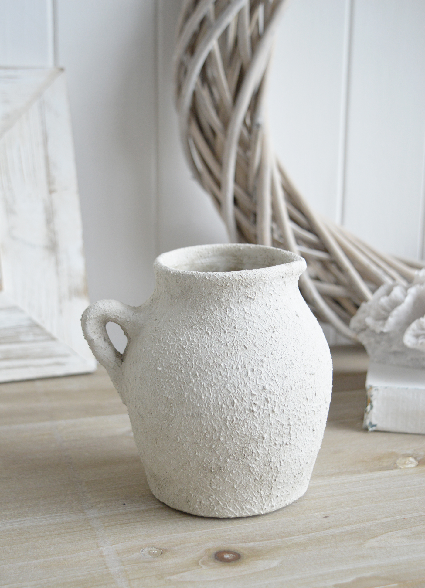 Whether filled with flowers or displayed alone, the Fremont aged white stone vases  add effortless elegance to any space.