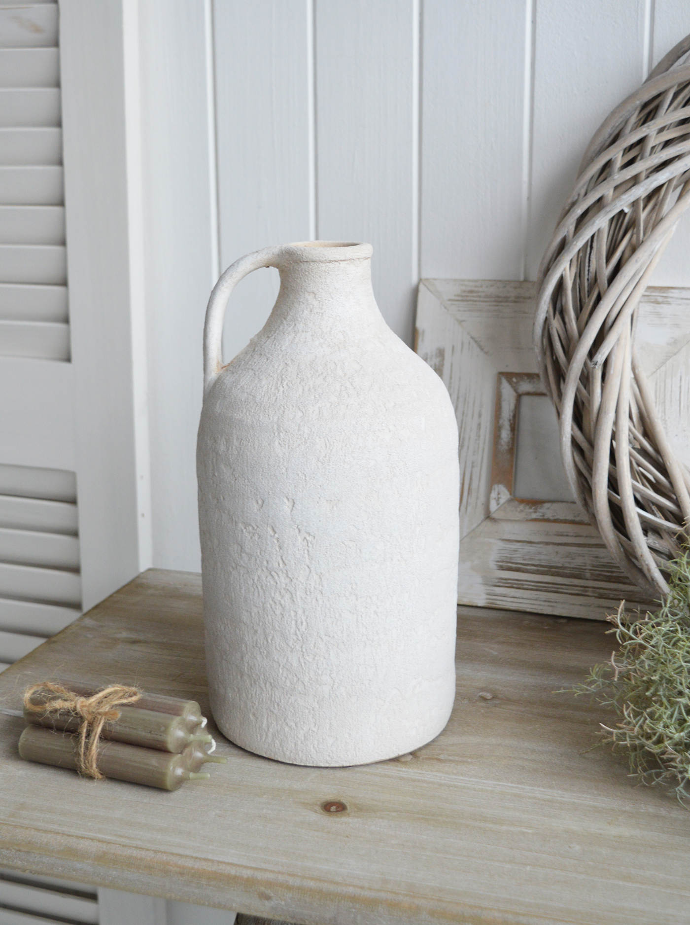 The neutral tones of the Fremont stone vases make them a versatile addition to both coastal and farmhouse interiors.