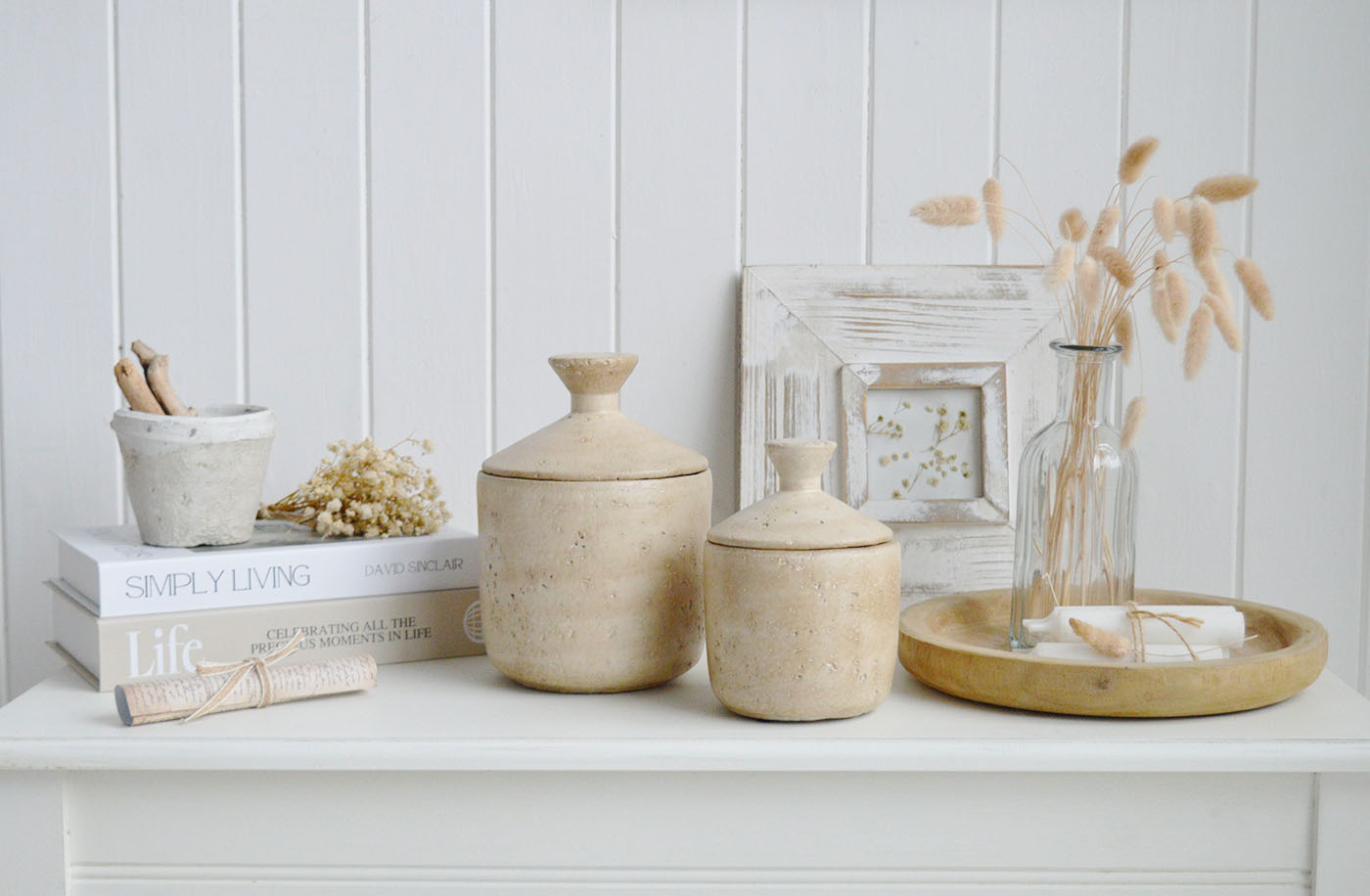 Crafted in a warm limestone finish with a gently aged stone texture, the Hearthstone jars add timeless charm to coastal beach house interiors, neutral living rooms and elegant console table styling.