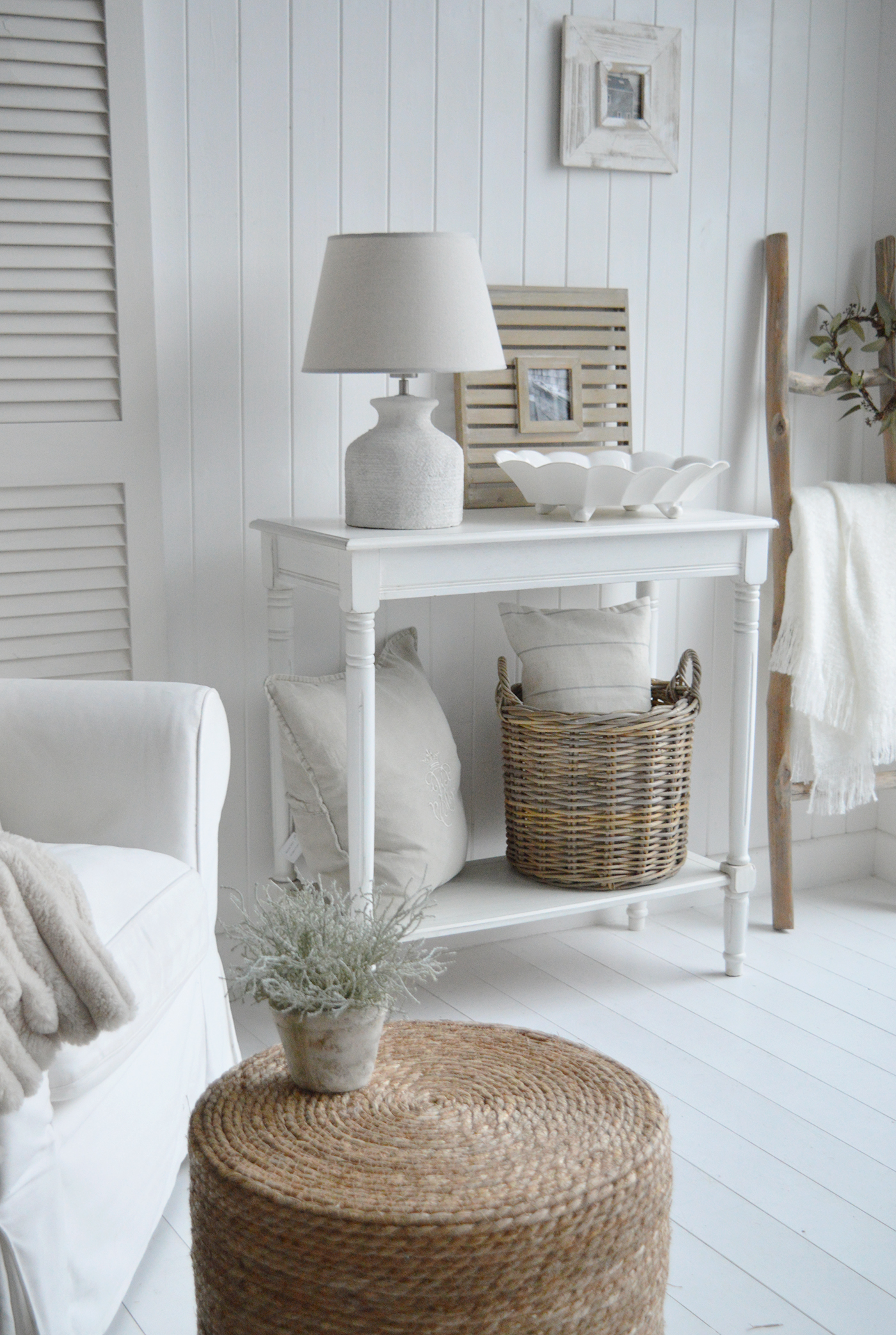 A New England modern famhouse style interior with white furniture and home decor accessories