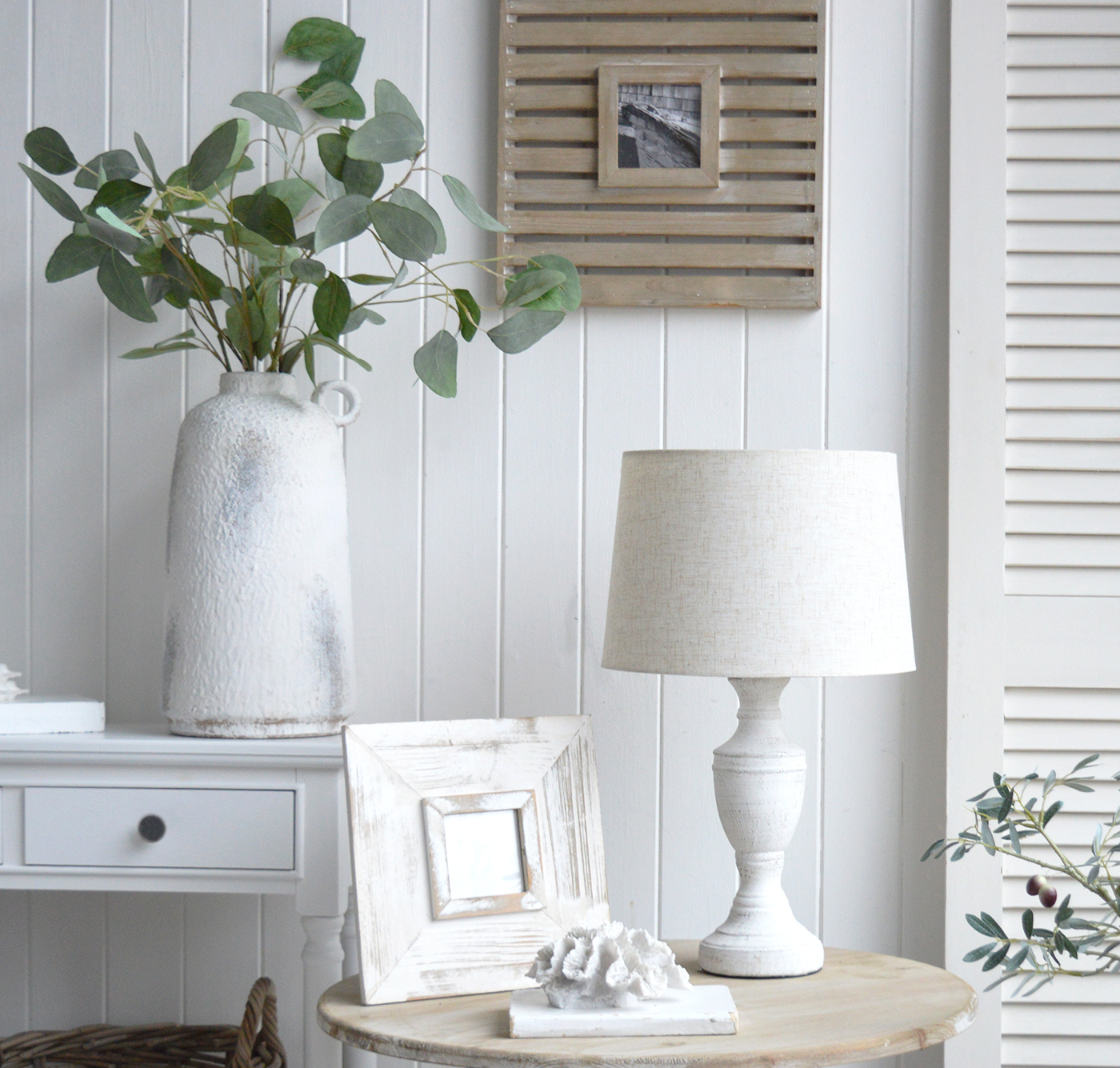 A modern farmhouse or coastal living room with the rustic Rockport stone lamp