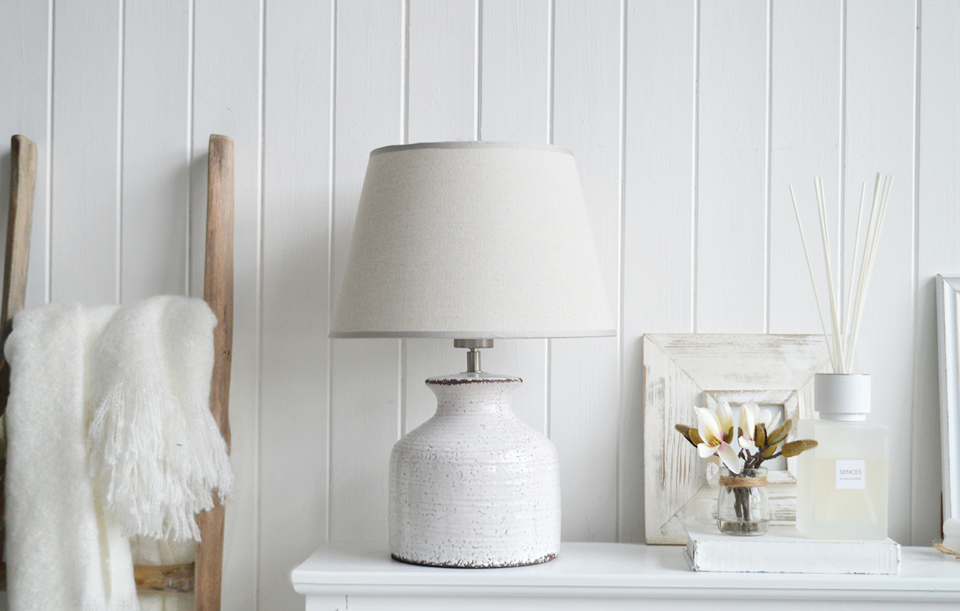 The White Compton white ceramic lamp with a glazed finish for - coastal inspired homes