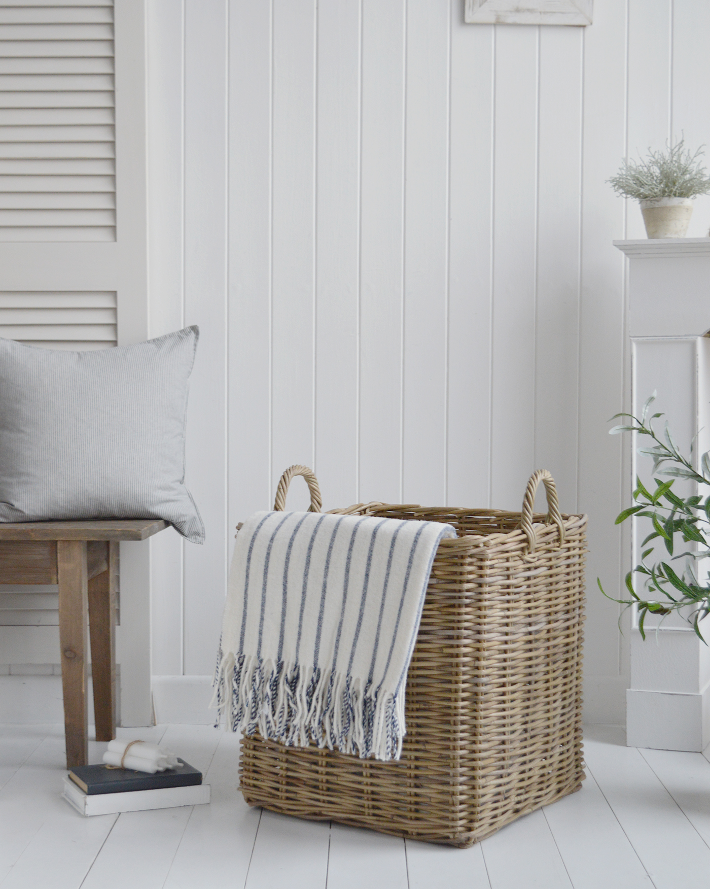 Large baskets - Casco bay grey rattan log basket with handles. Shown here with the Sudbury wool throw in blue and white
