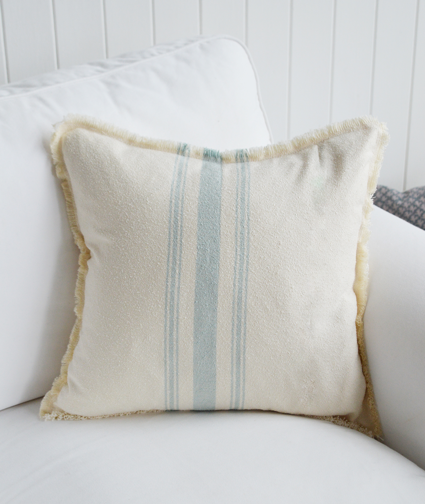 Nautical-themed Lexington coastal cushion styled in a living room