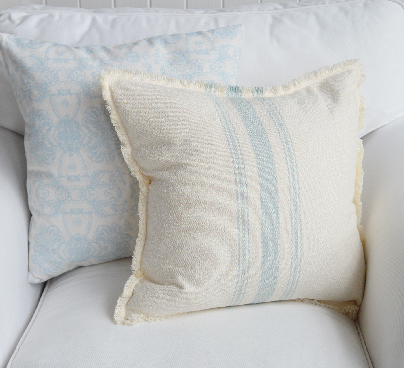 Lexington Coastal cushions on a white sofa with neutral tones