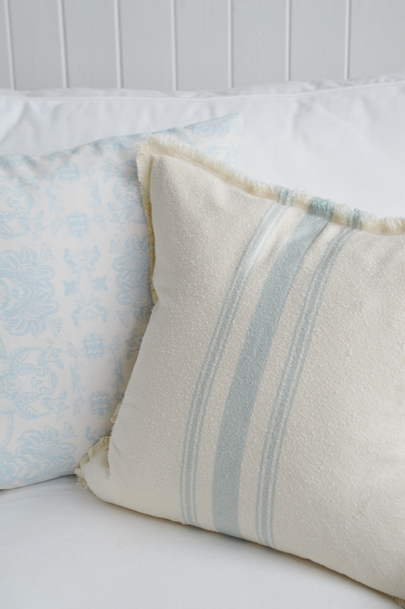 Lexington Light blue and cream coastal cushions on a cosy couch