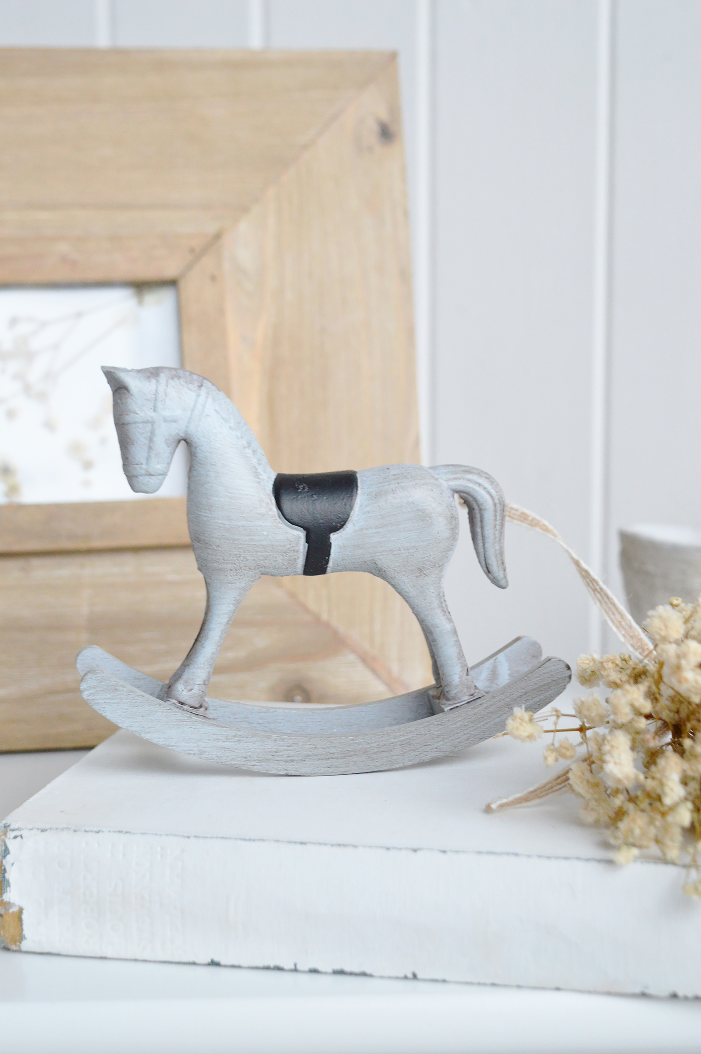 This decorative grey rocking horse is a timeless styling piece for neutral, New England and farmhouse interiors.