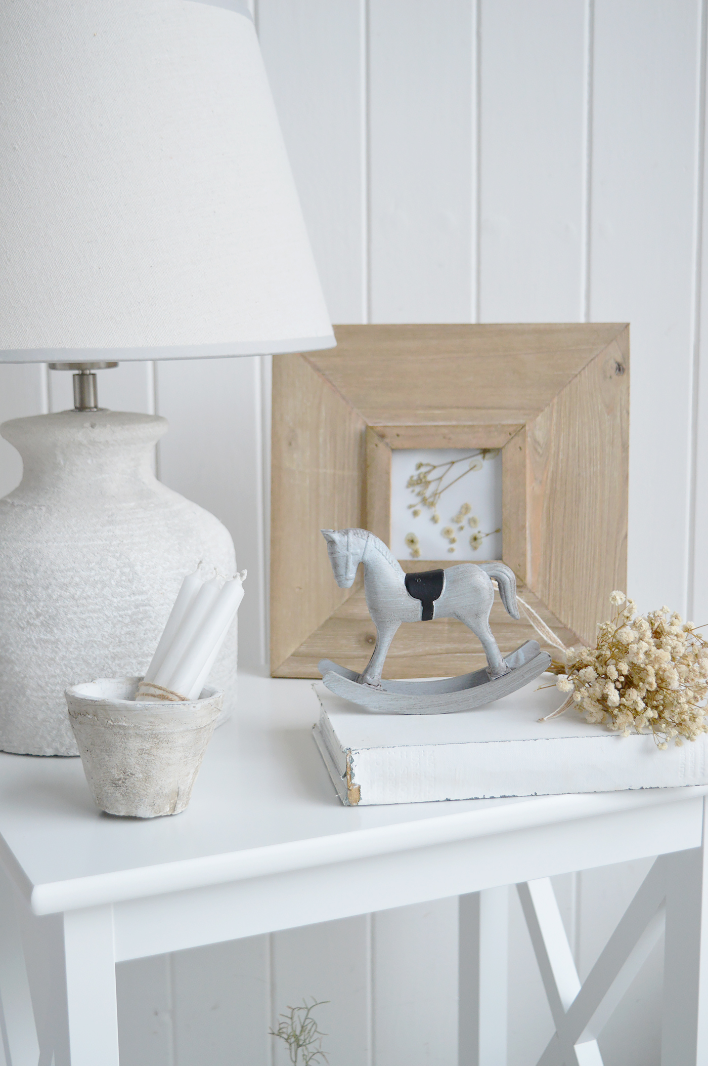 Finished in a soft, weathered grey, this small rocking horse ornament adds gentle character to shelves and side tables.