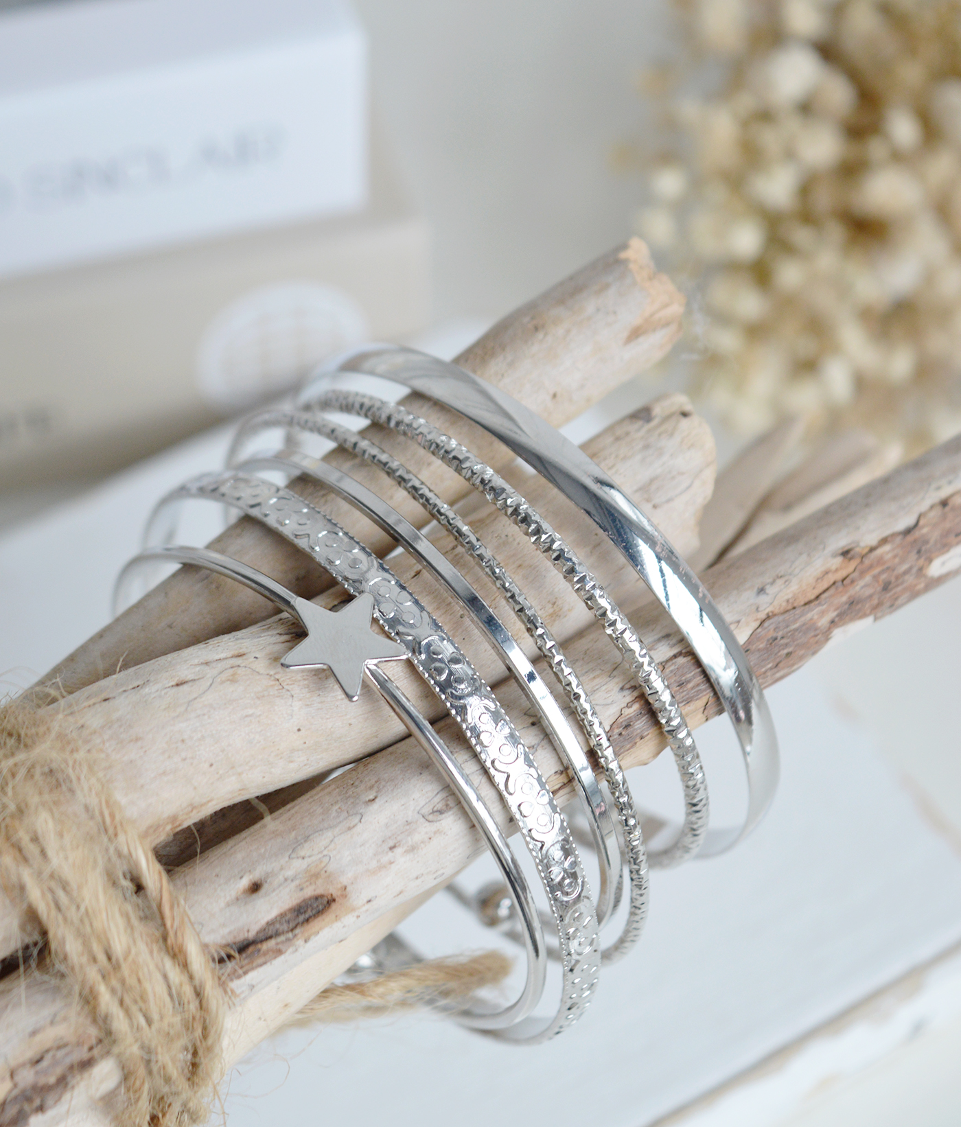 A versatile silver-tone bracelet set that complements the timeless New England and coastal aesthetic of The White Lighthouse.